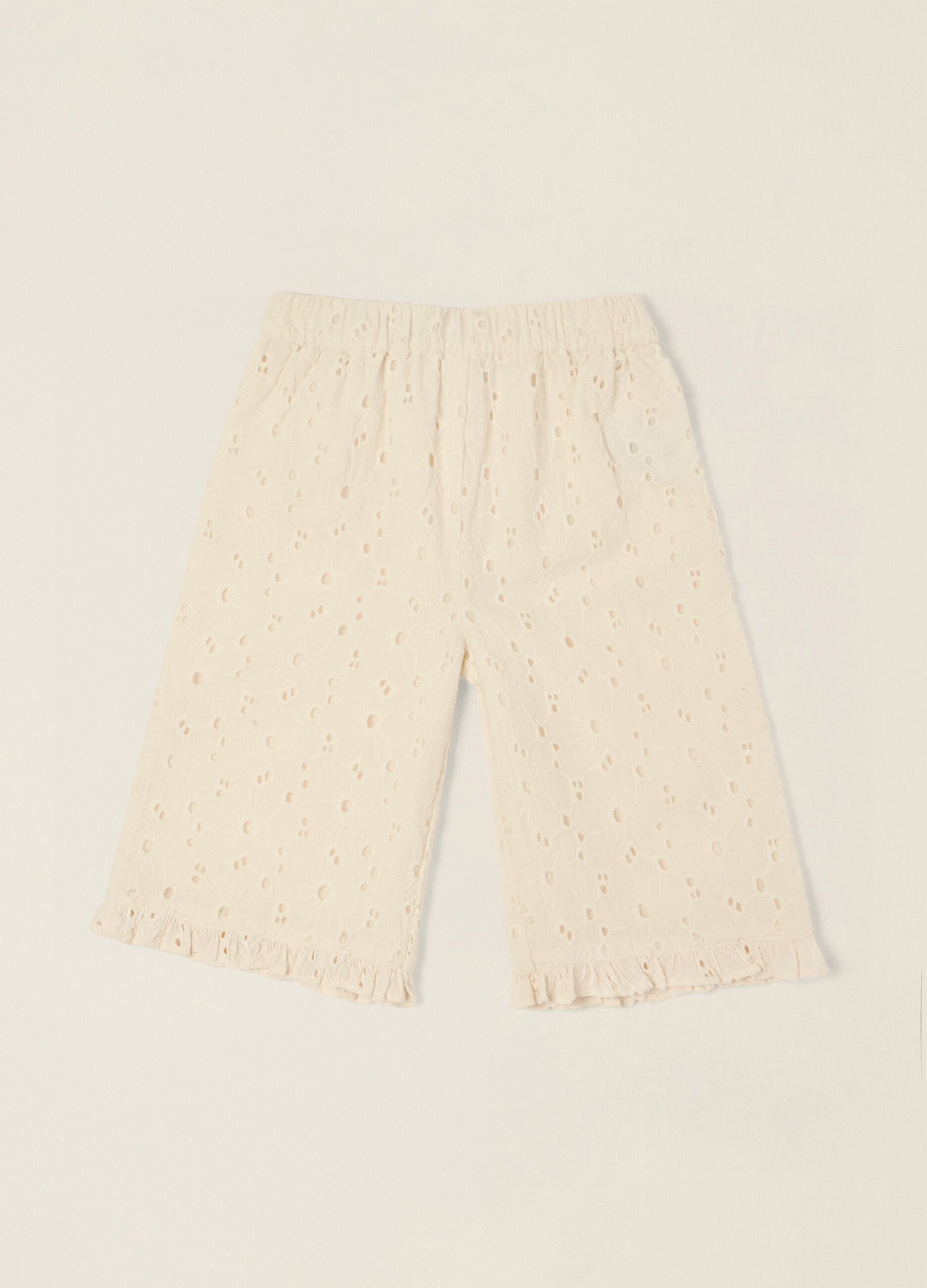 White broderie cotton trousers for baby girls