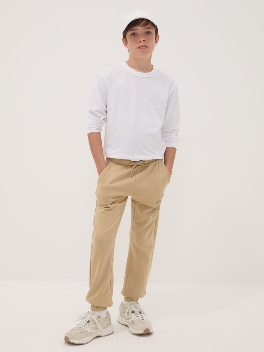 Pantaloni jogger marroni in puro cotone con stampa_0