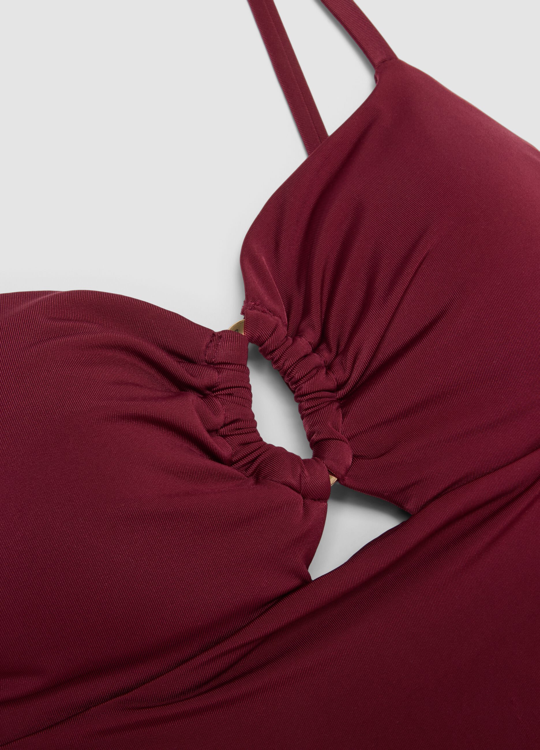 Red stretchy one-piece swimsuit with straps