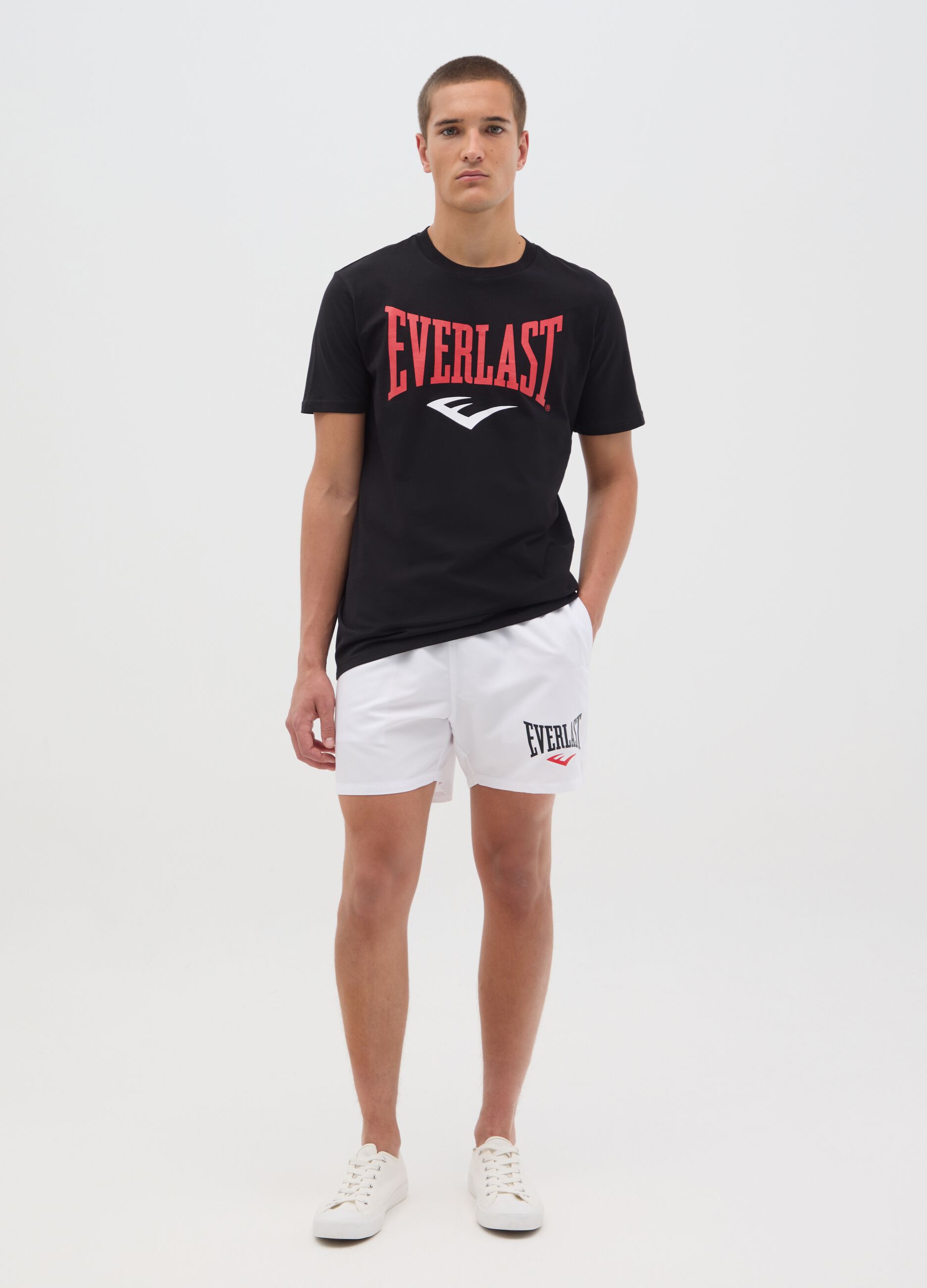 White swimming trunks with logo print