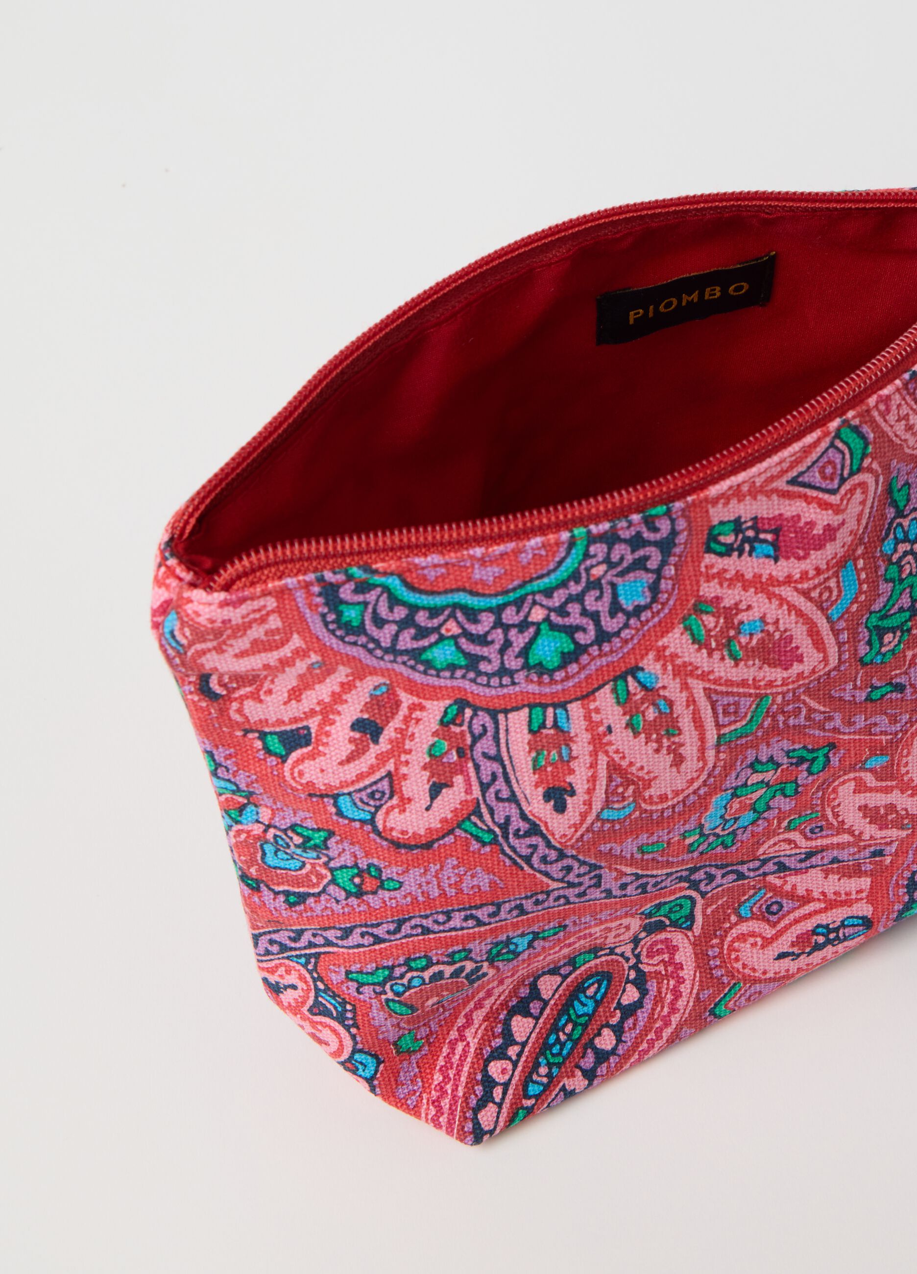 Clutch bag with tassel and paisley print