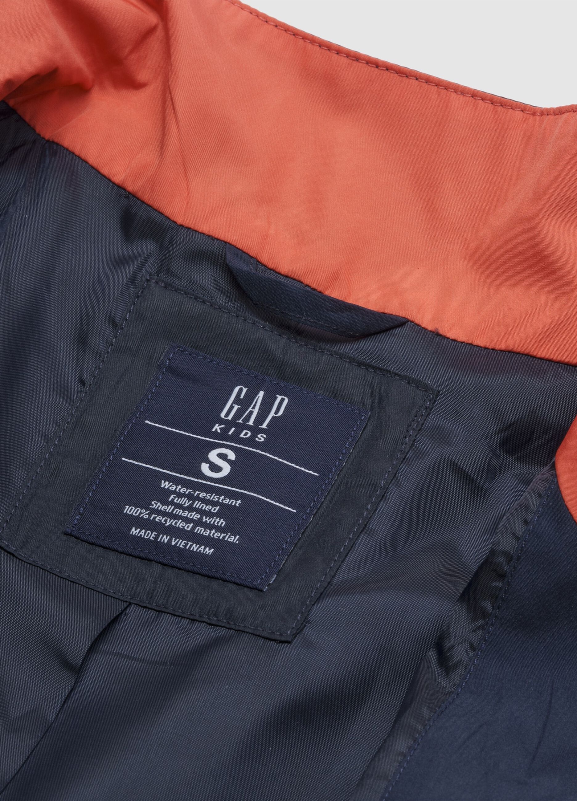 Light blue jacket with orange and grey accents