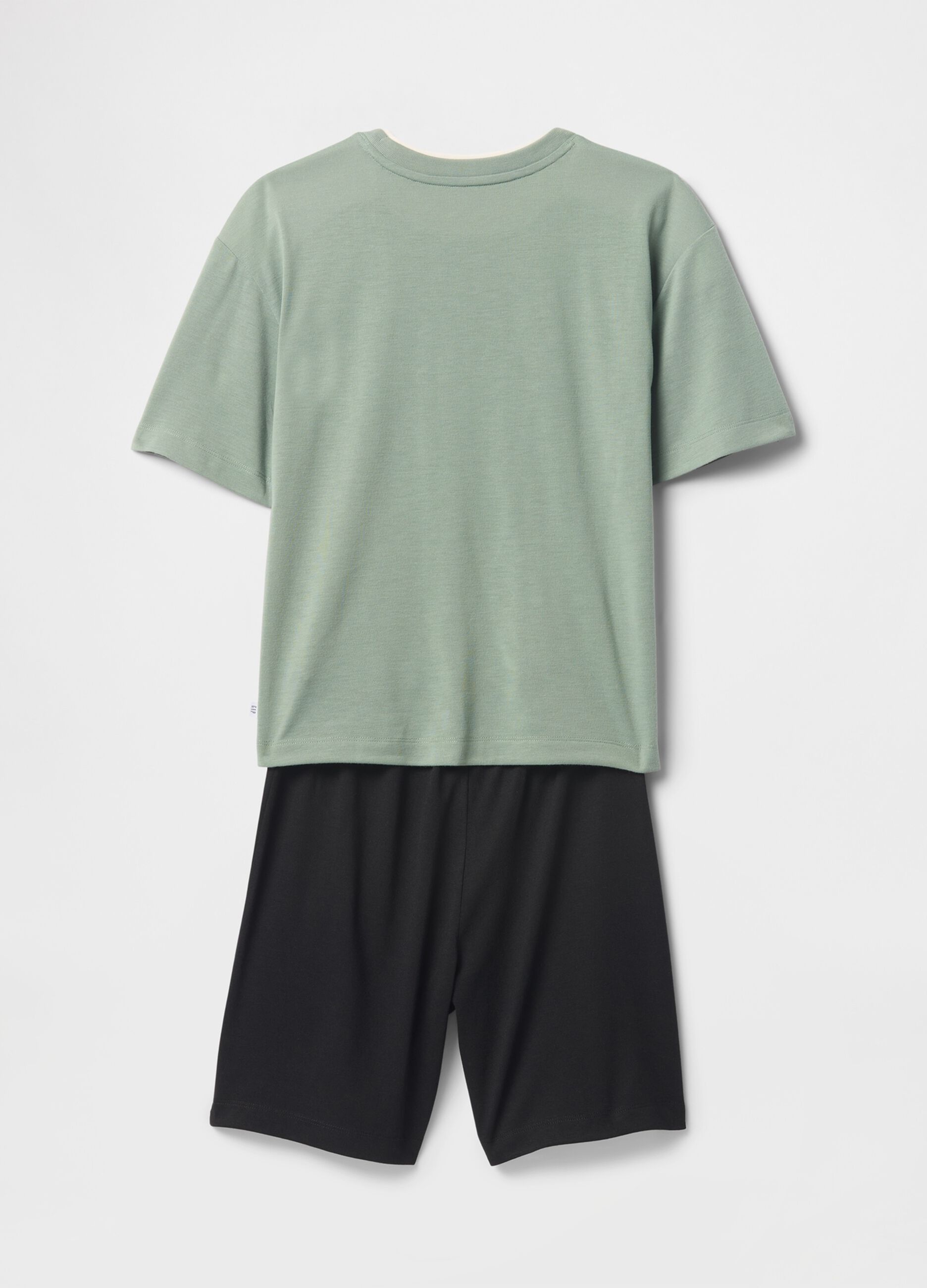 Green kids' pyjamas with football theme