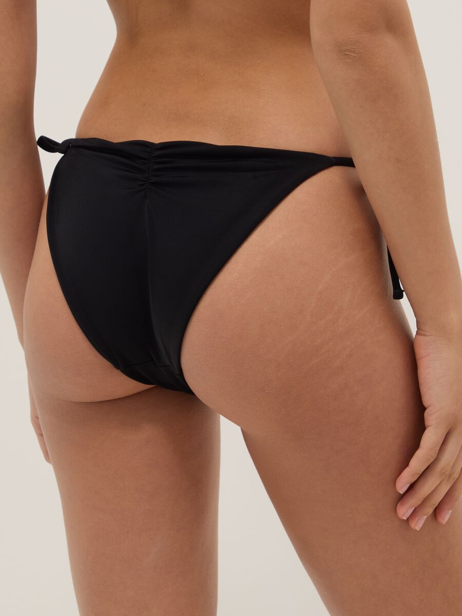Black stretch bikini bottoms with decorative beads_2