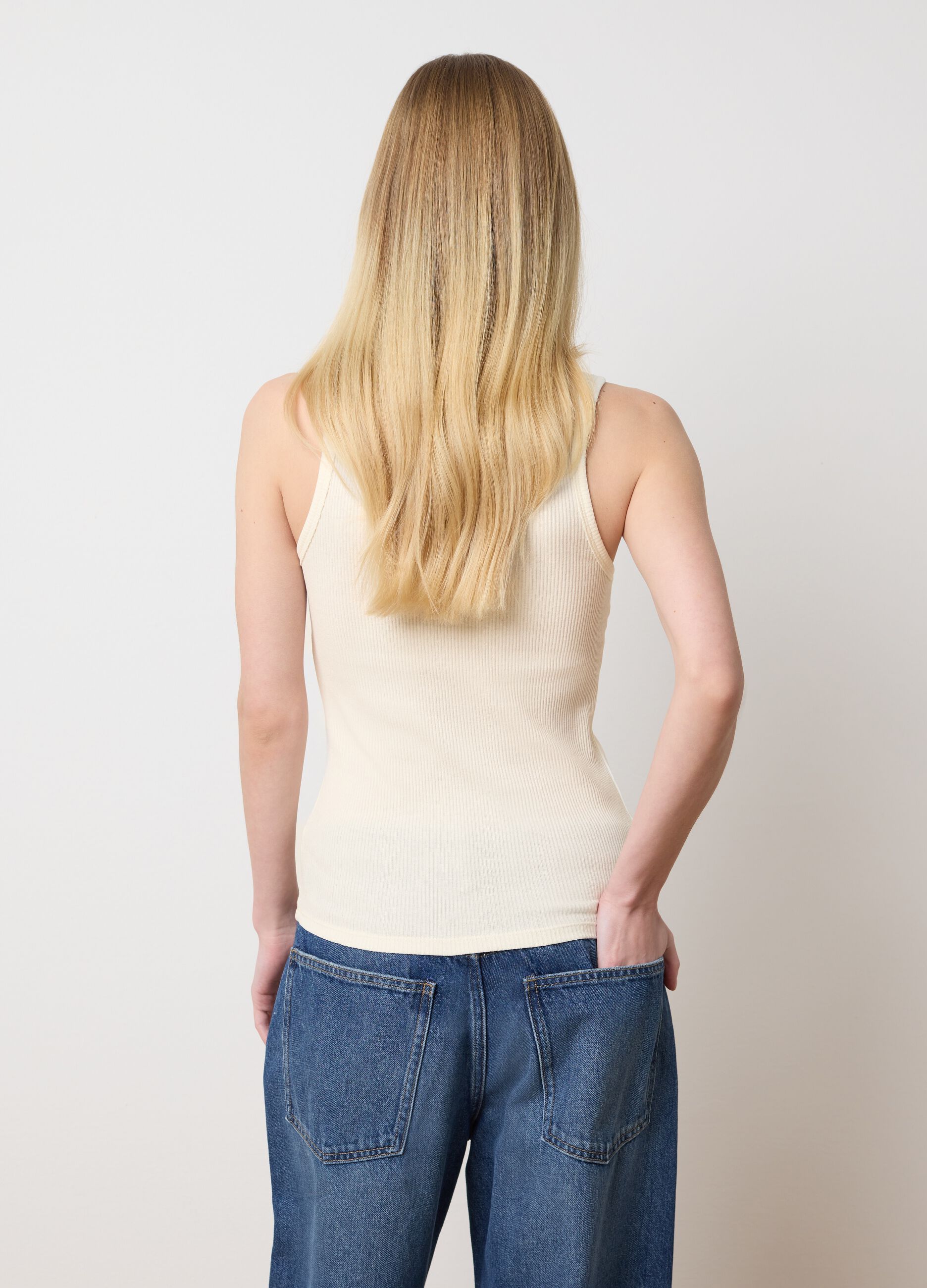 Ivory sleeveless top with embroidered details