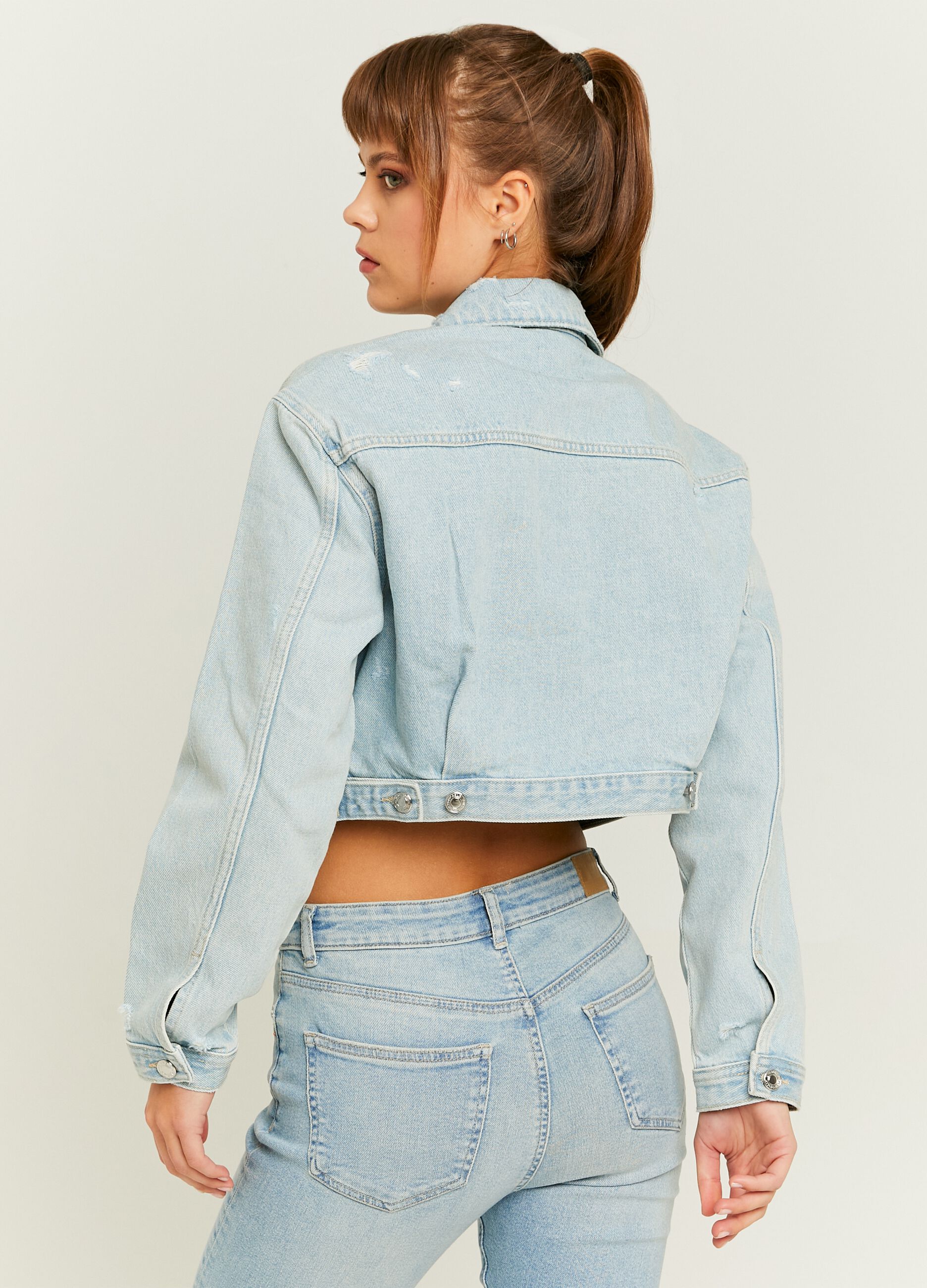 Giacca crop in denim acid wash