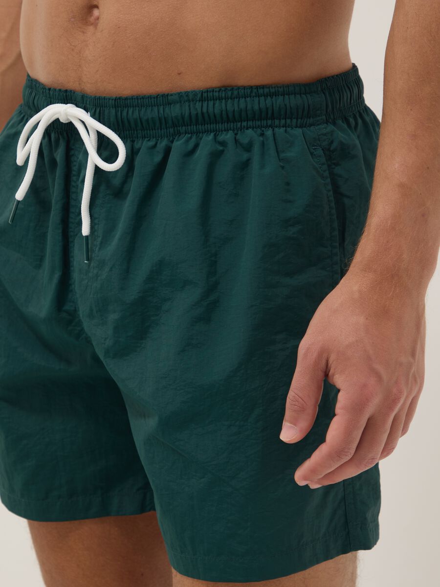 Green swim shorts with elasticated waistband_3