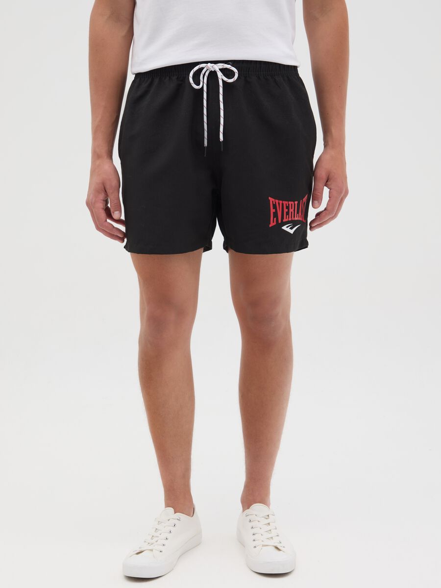 Black swimming trunks with logo print_1