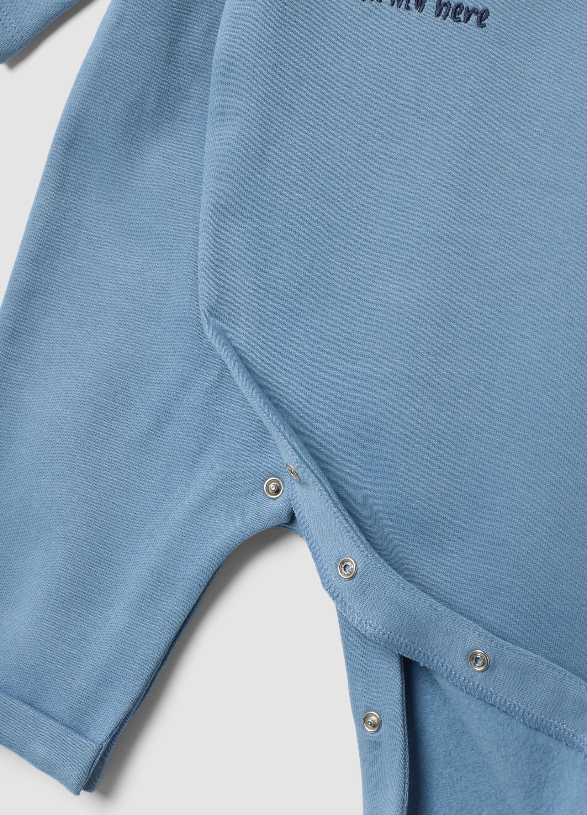 Tutina azzurra in puro cotone organico con ricamo