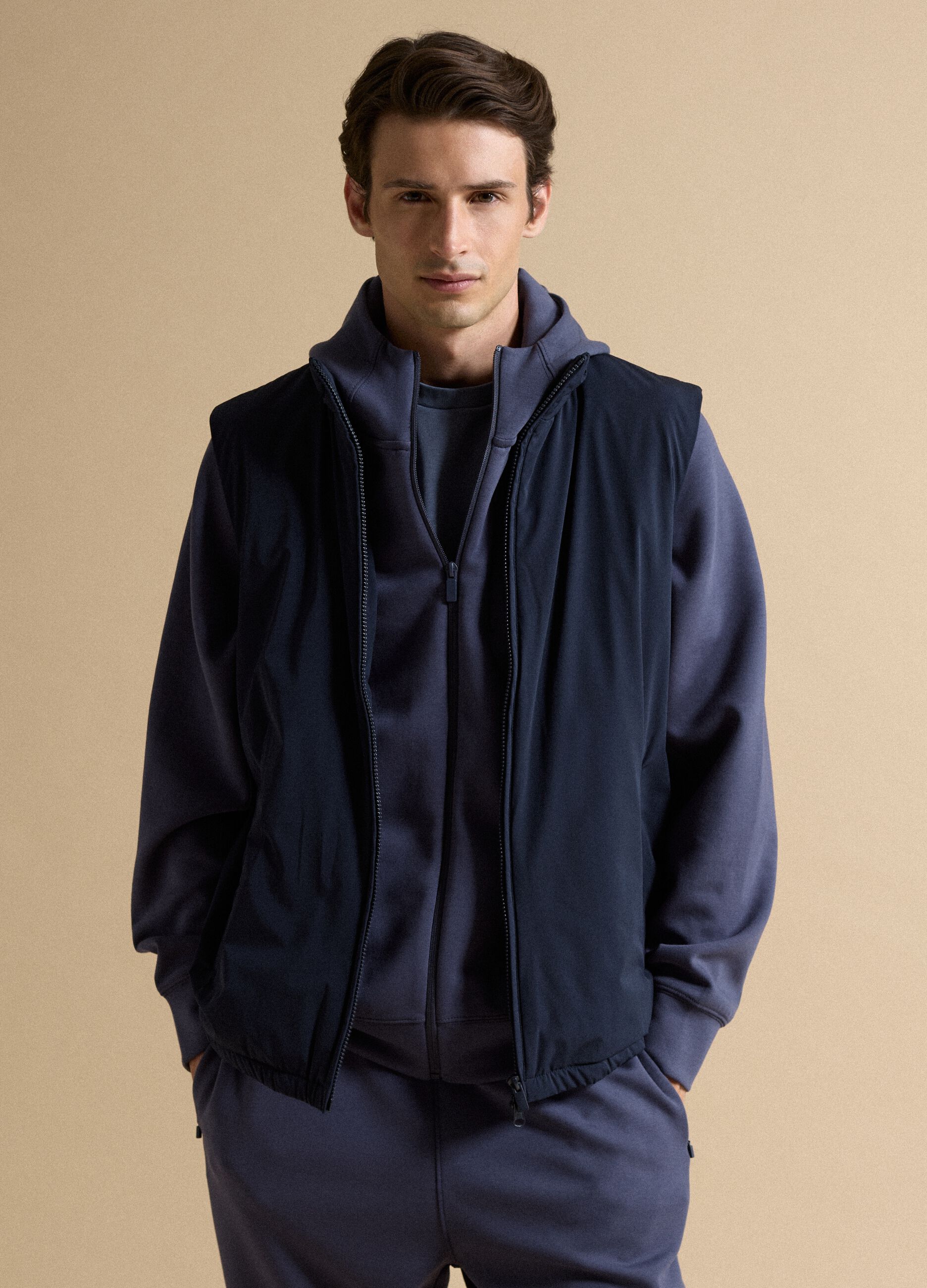 Blue stretch-fabric gilet with zip