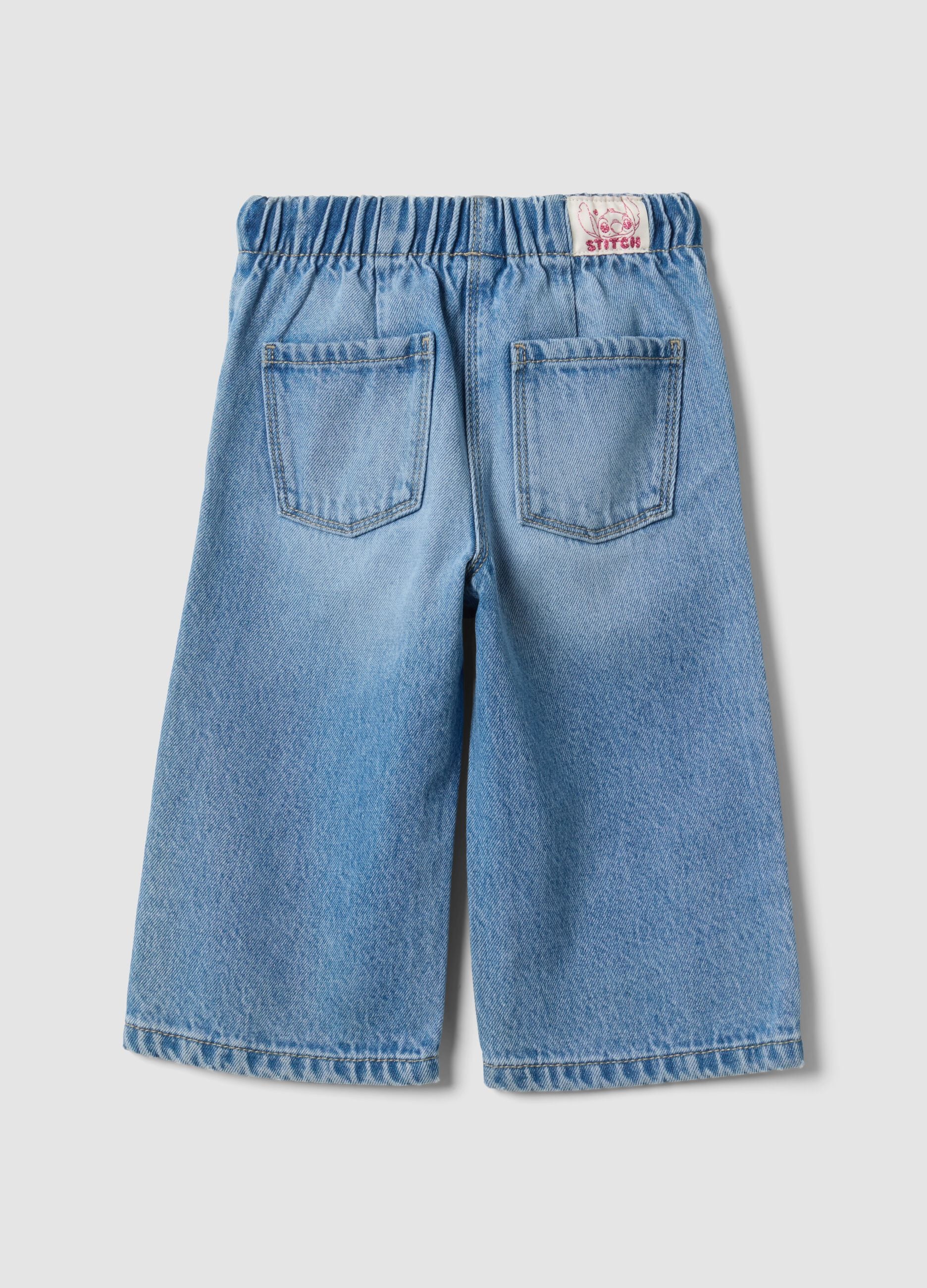 Light blue cotton and lyocell blend jeans with Lilo & Stitch print for baby girl