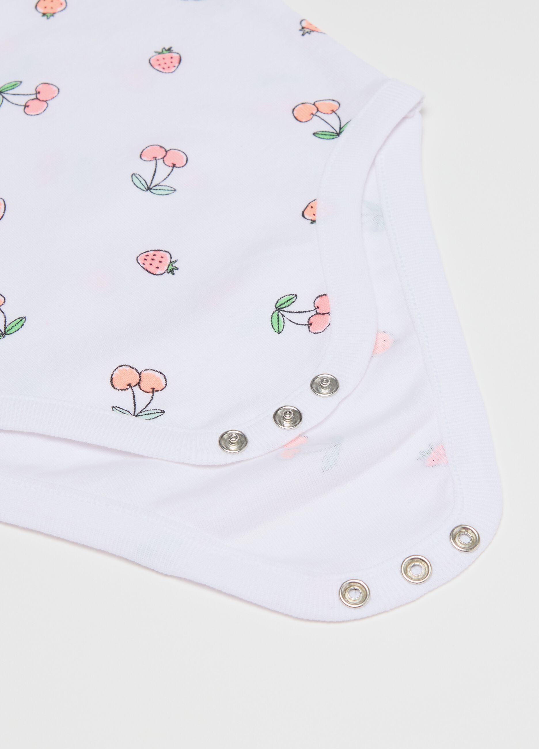 Three-pack sleeveless pink and white bodysuits in organic cotton with print