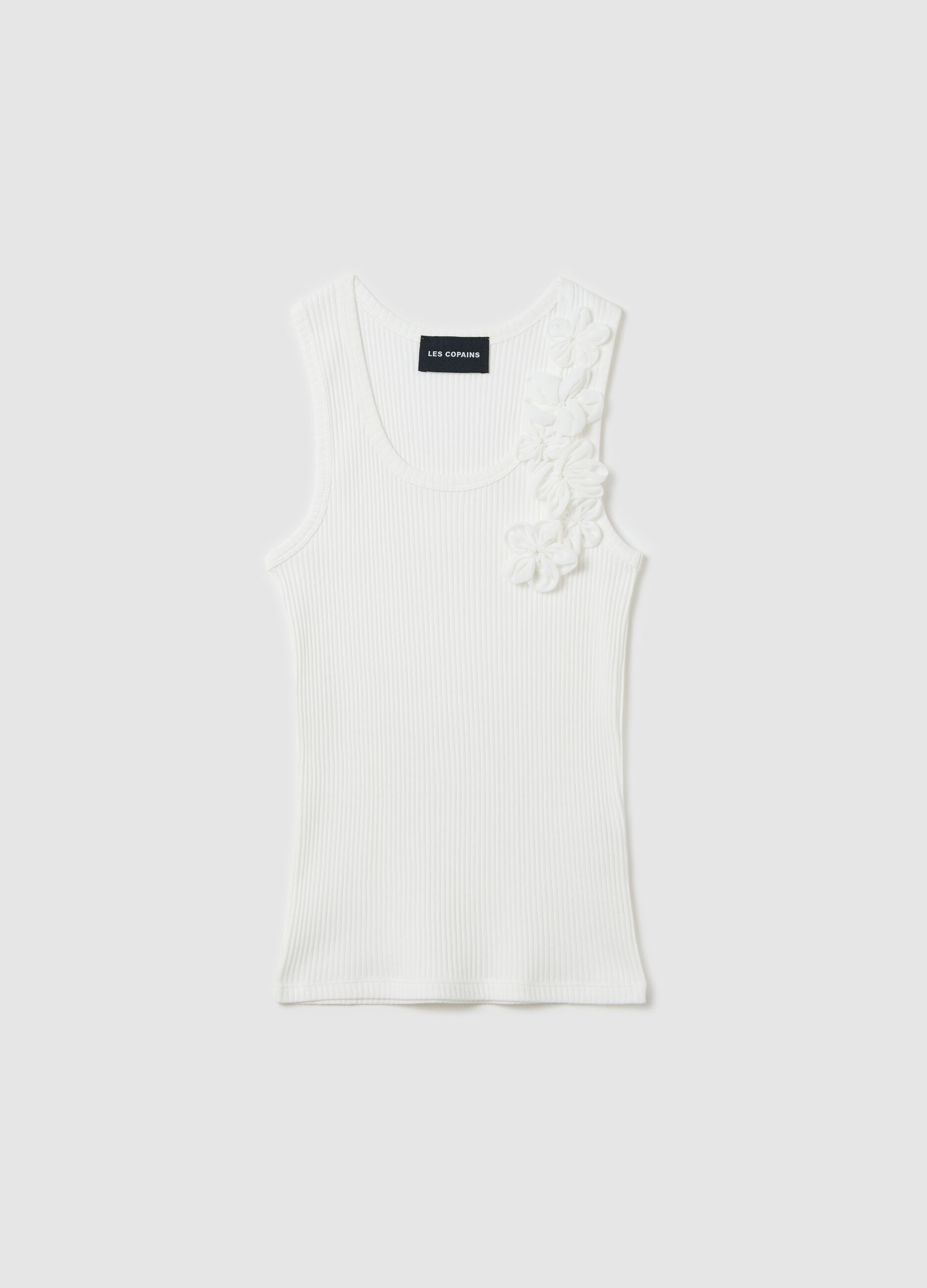 Top bianco a costine con applicazioni floreali