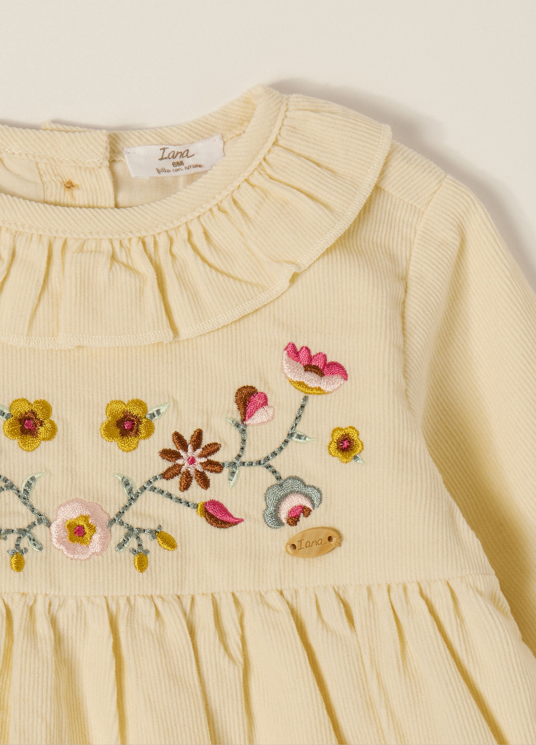 Beige corduroy dress with floral embroidery