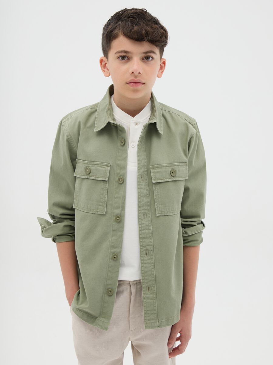 Boys’ shirt in 100% green cotton with oversized fit and button fastening_0