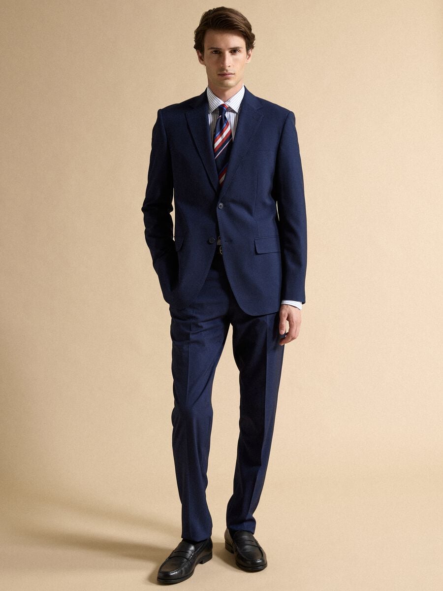 Pantaloni formali blu in tessuto stretch slim fit_0