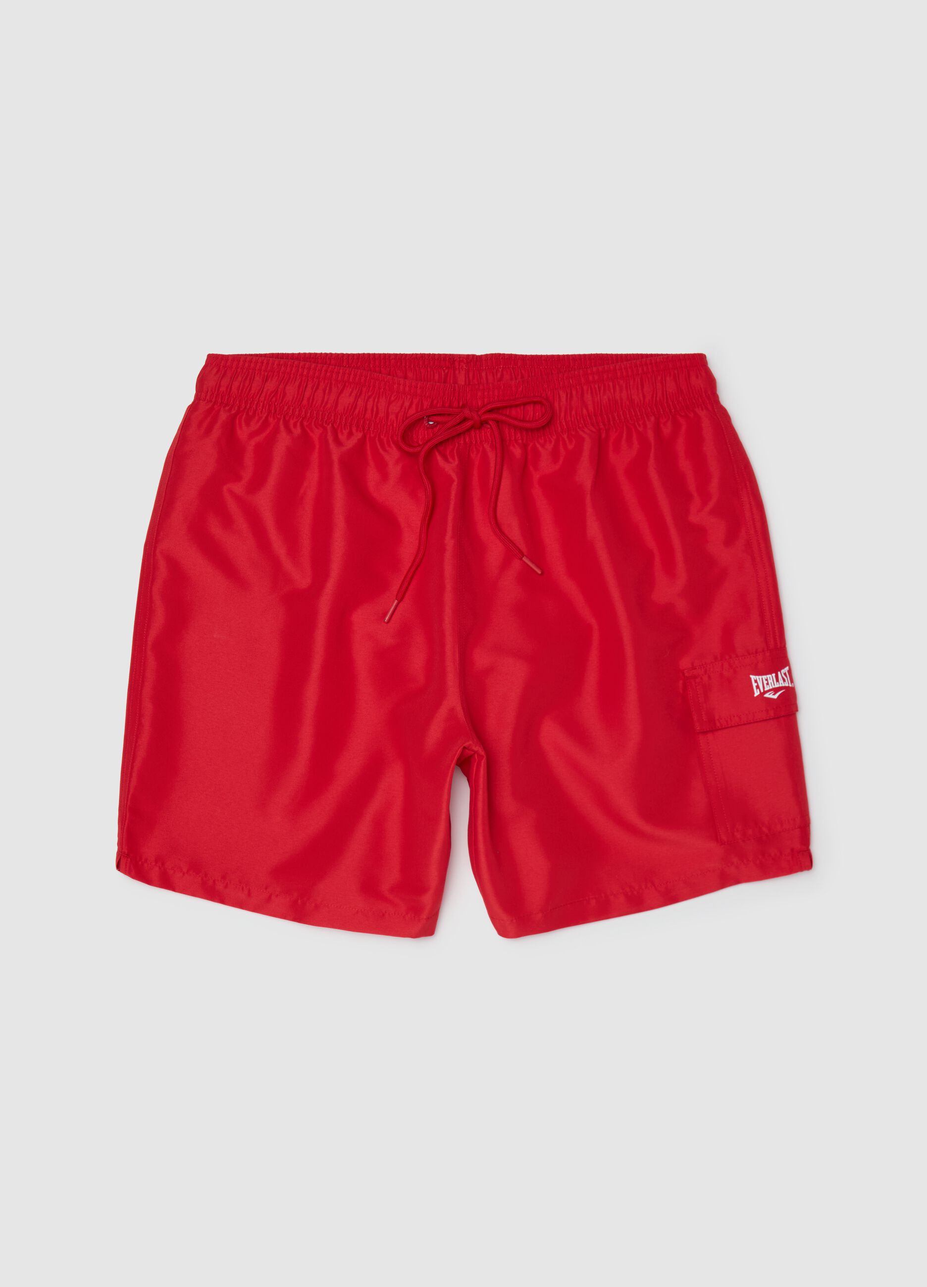 Red swimming trunks with logo print
