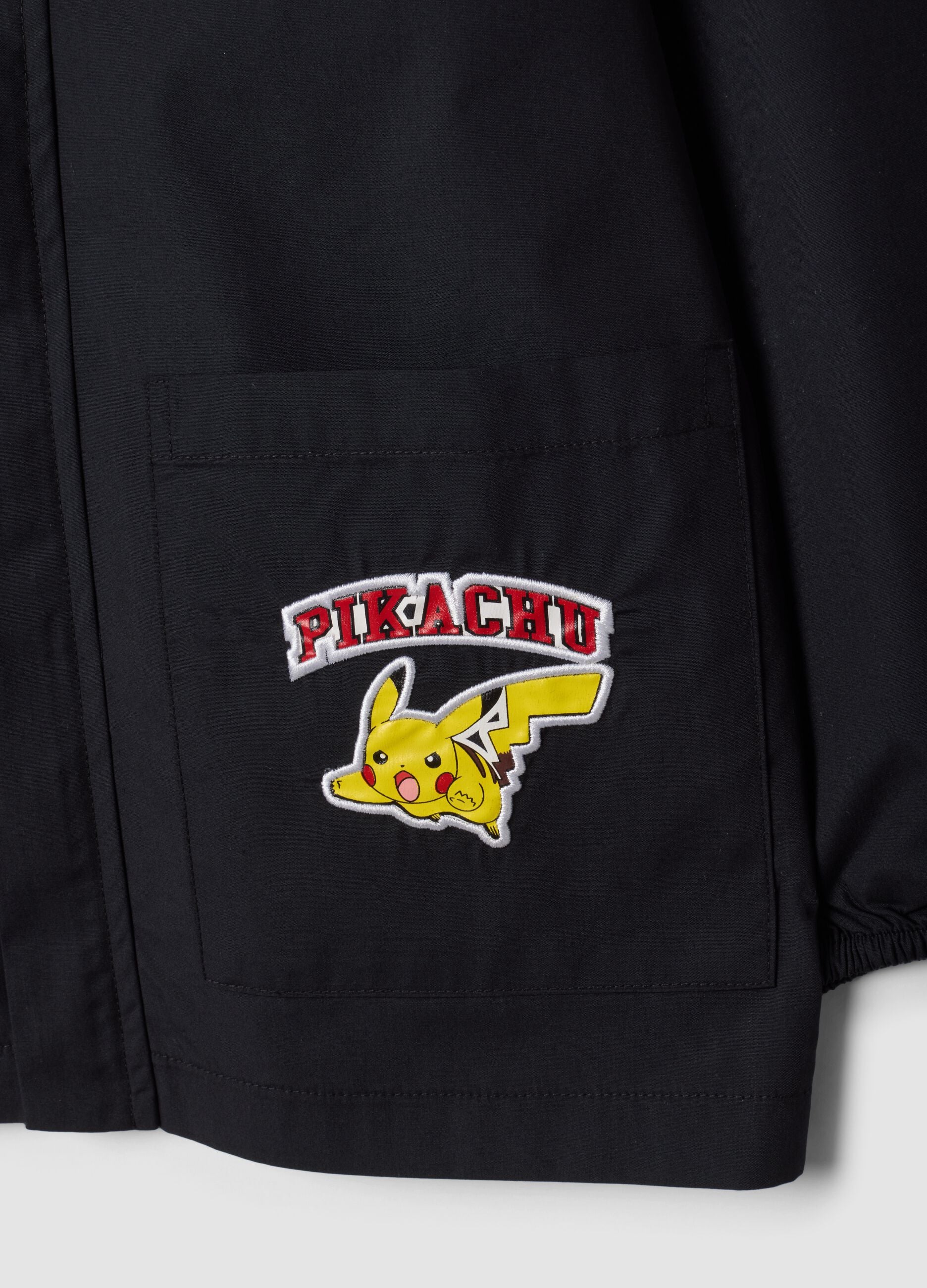 Black zip-up Pok&eacute;mon embroidered school apron for boys