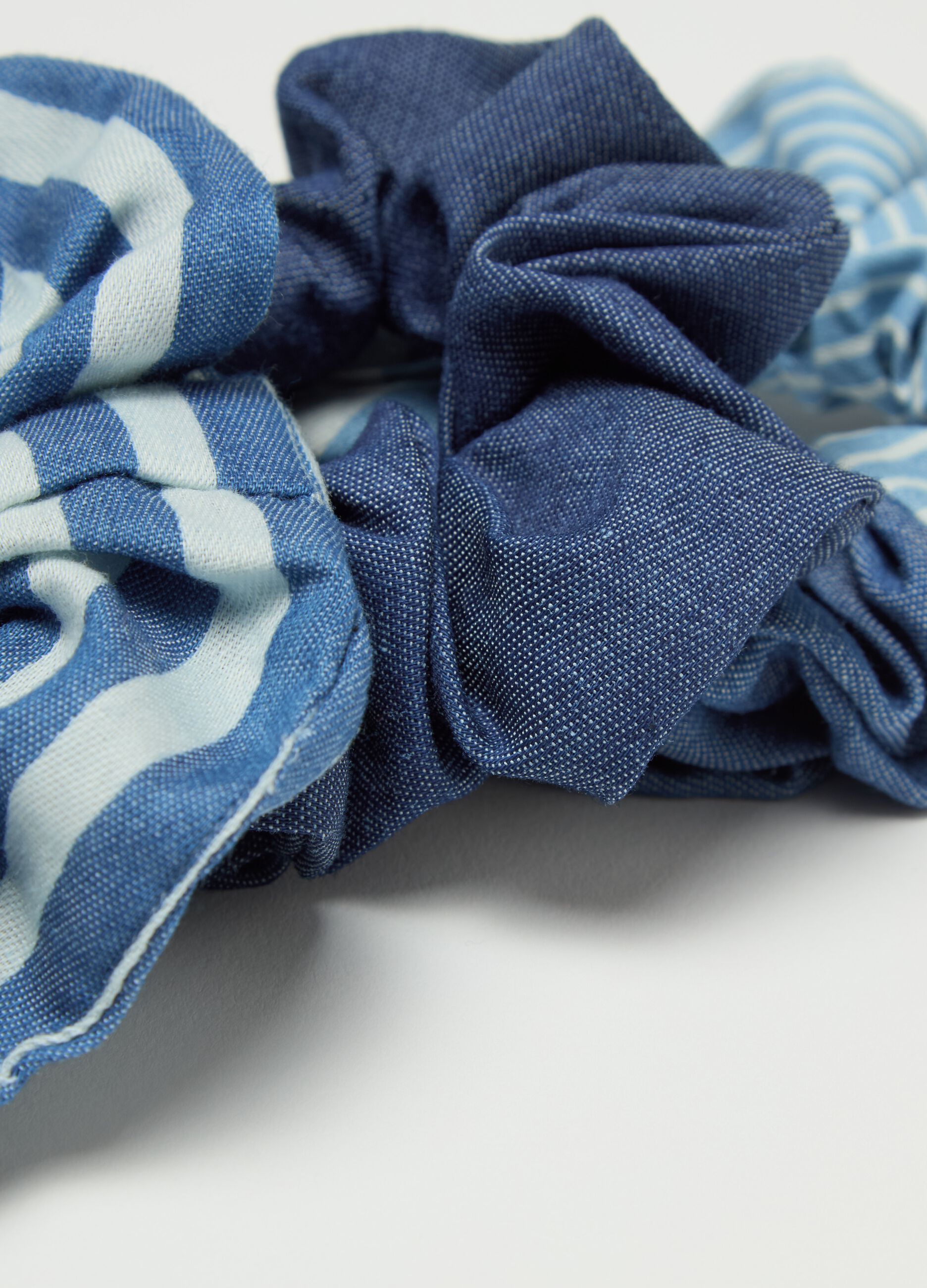 Three-pack hair elastics with white and blue stripes