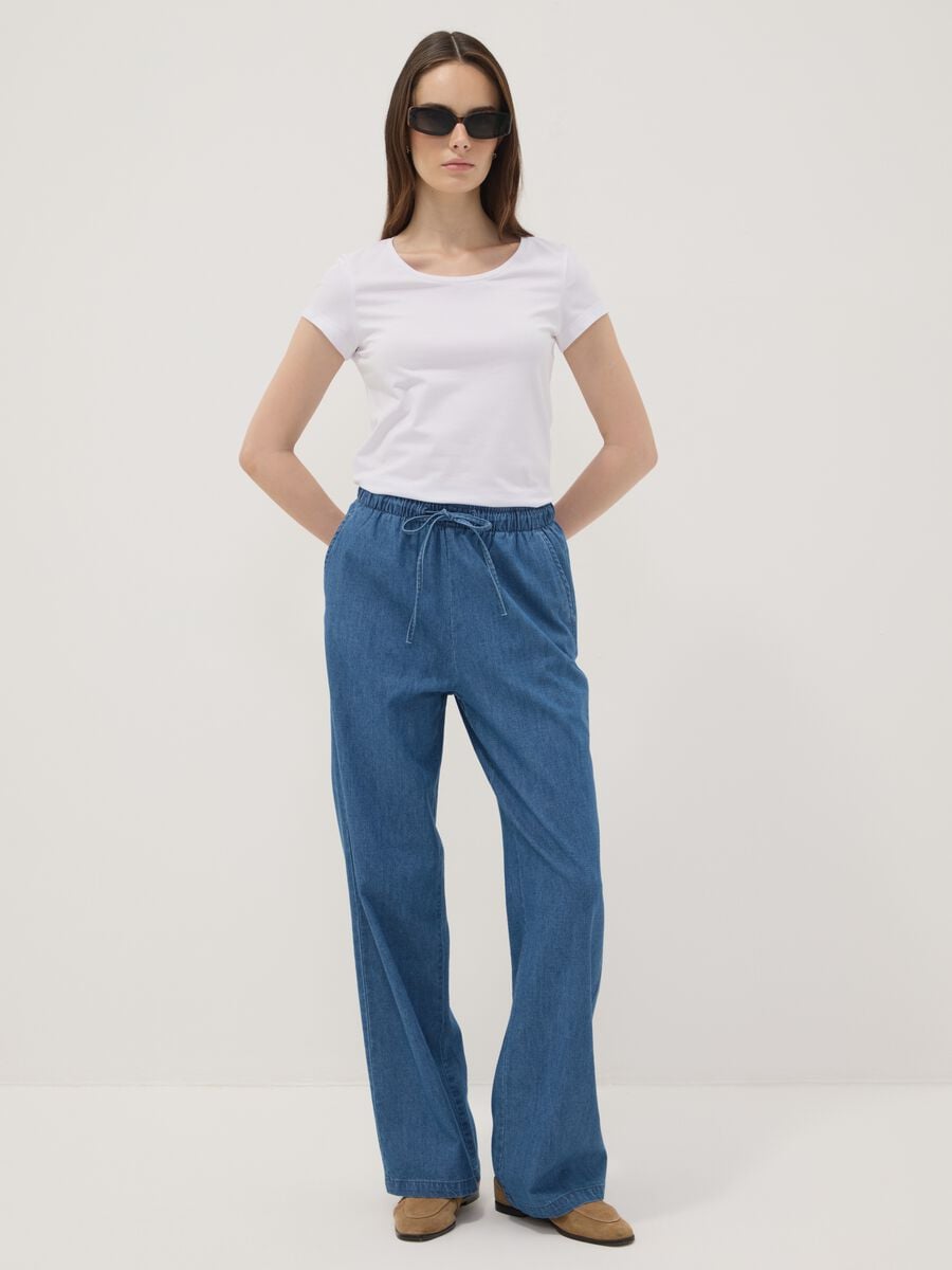 Pantaloni denim blu in puro cotone wide leg con coulisse_0