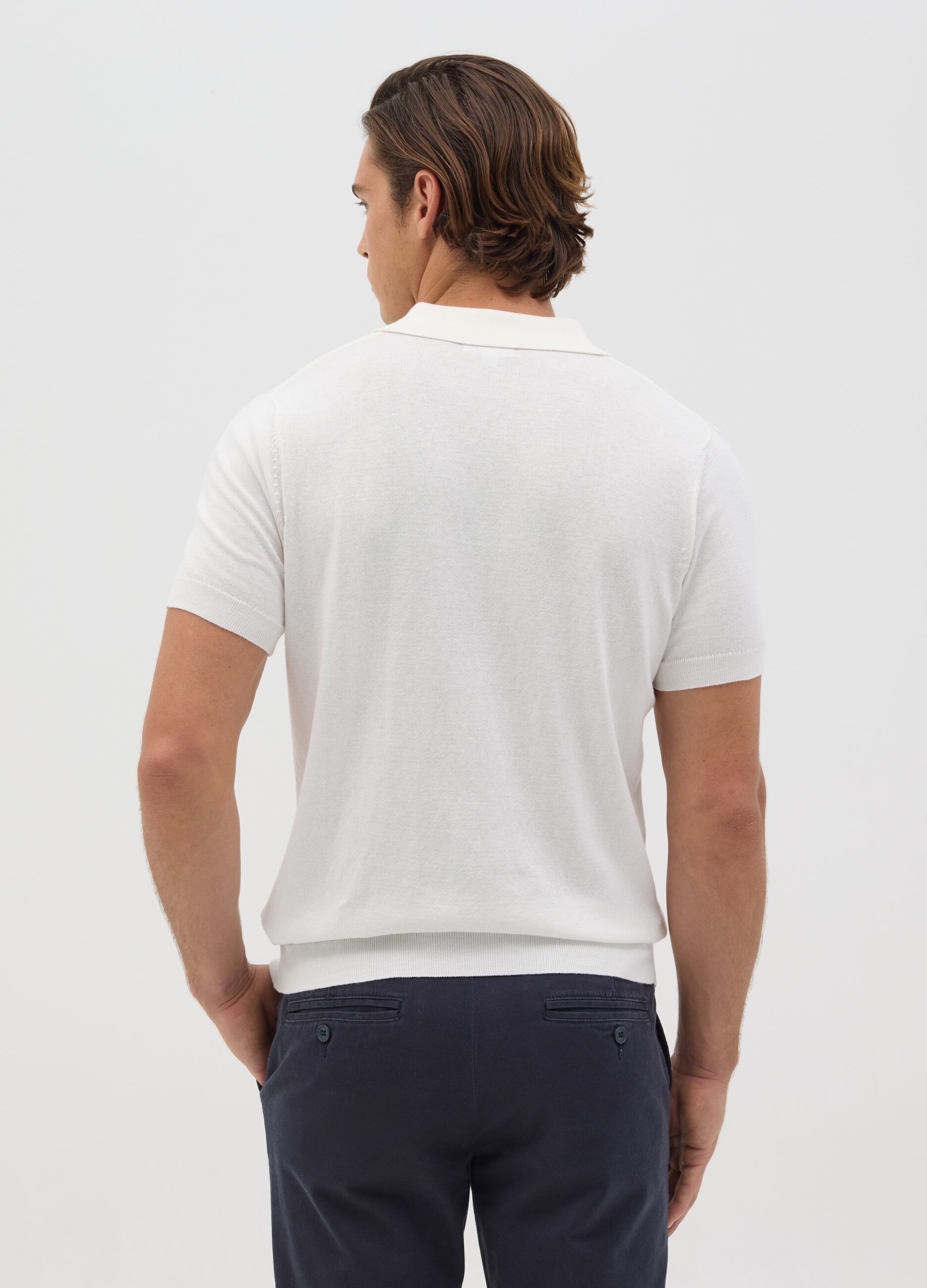 Polo bianca in maglia con trama jacquard
