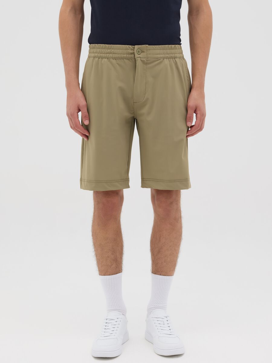 Green shorts with button and zip closure_1