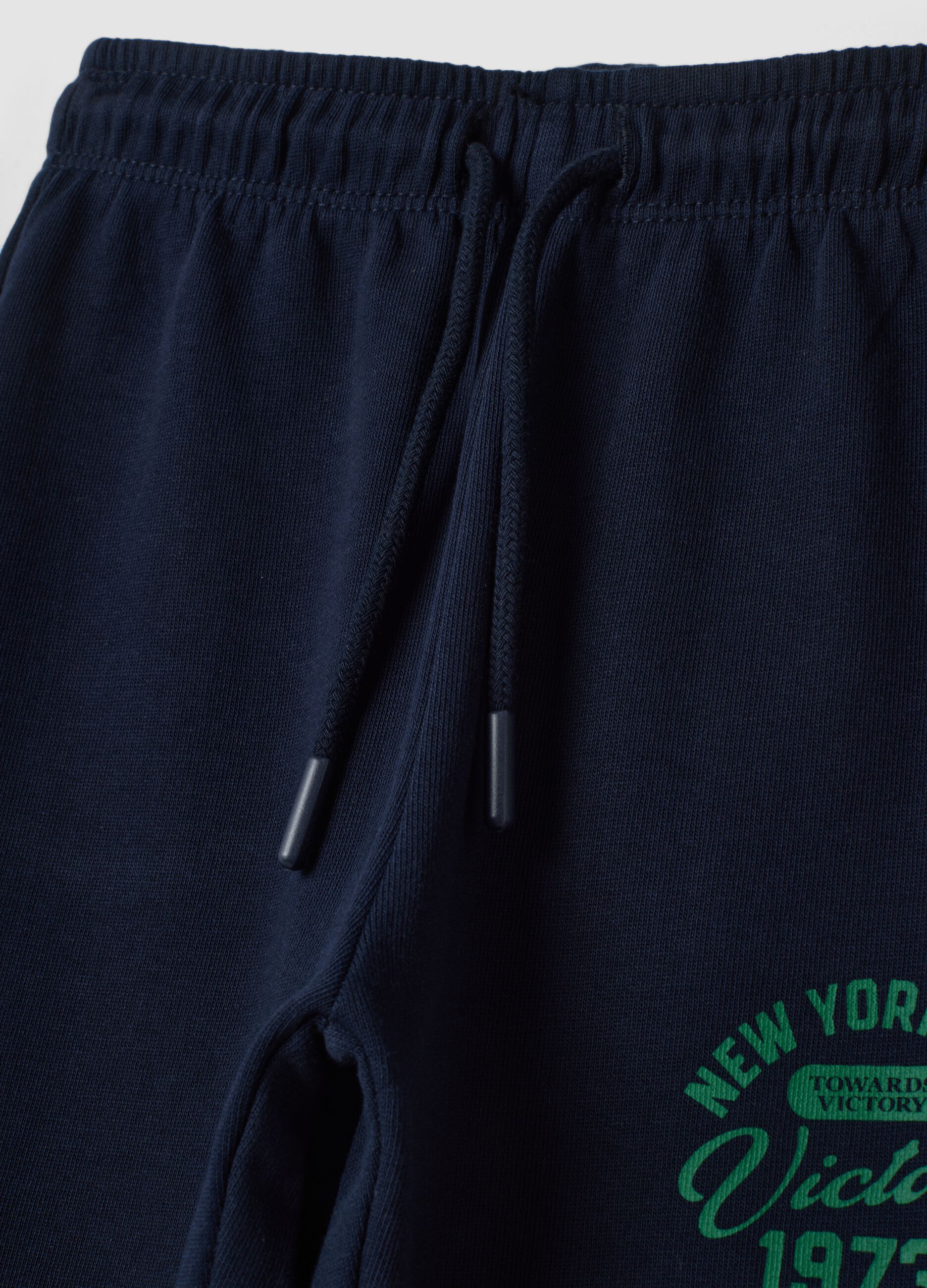 Pantaloni jogger blu in puro cotone con stampa