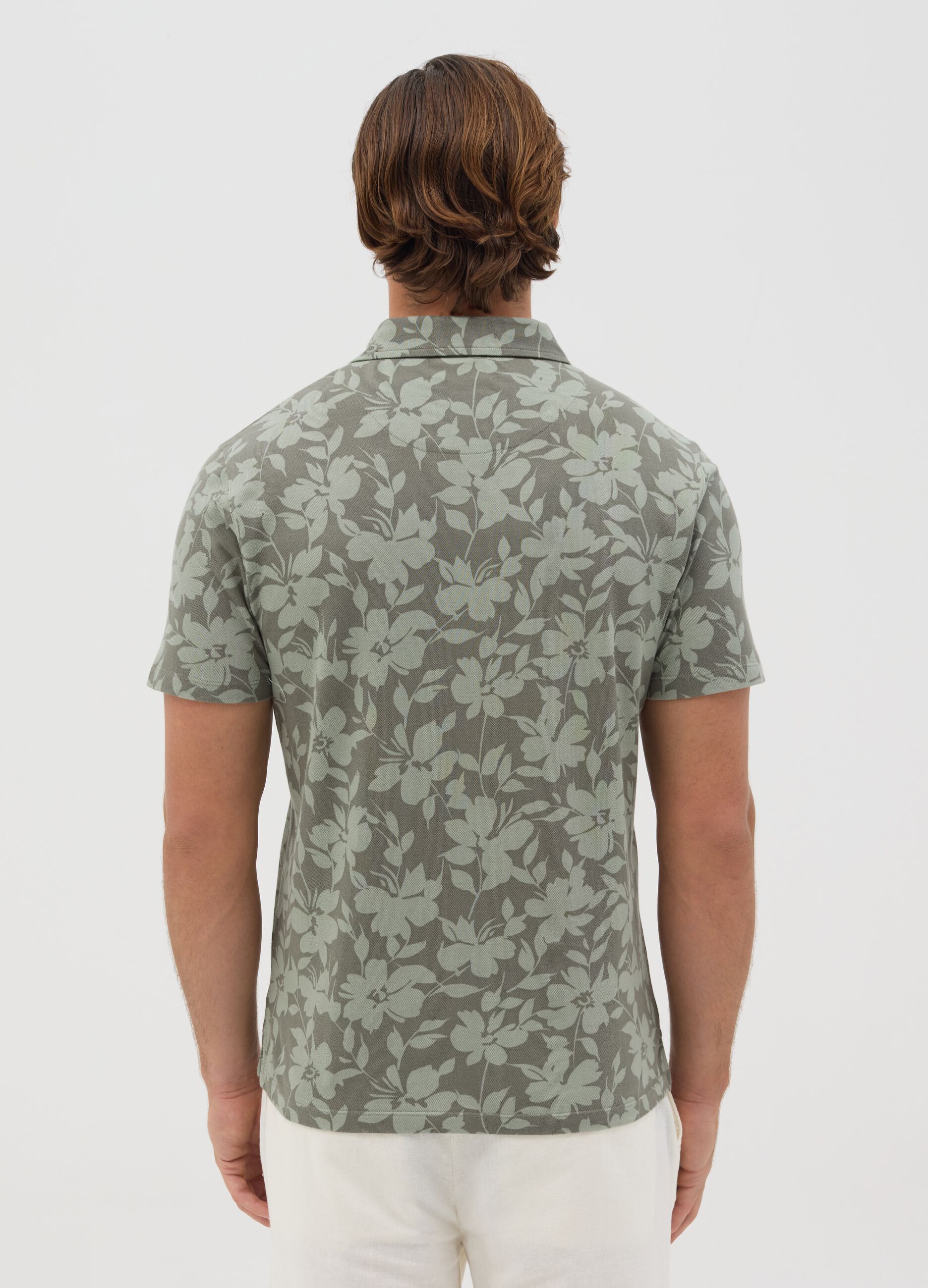 Polo a maniche corte verde con stampa floreale BST