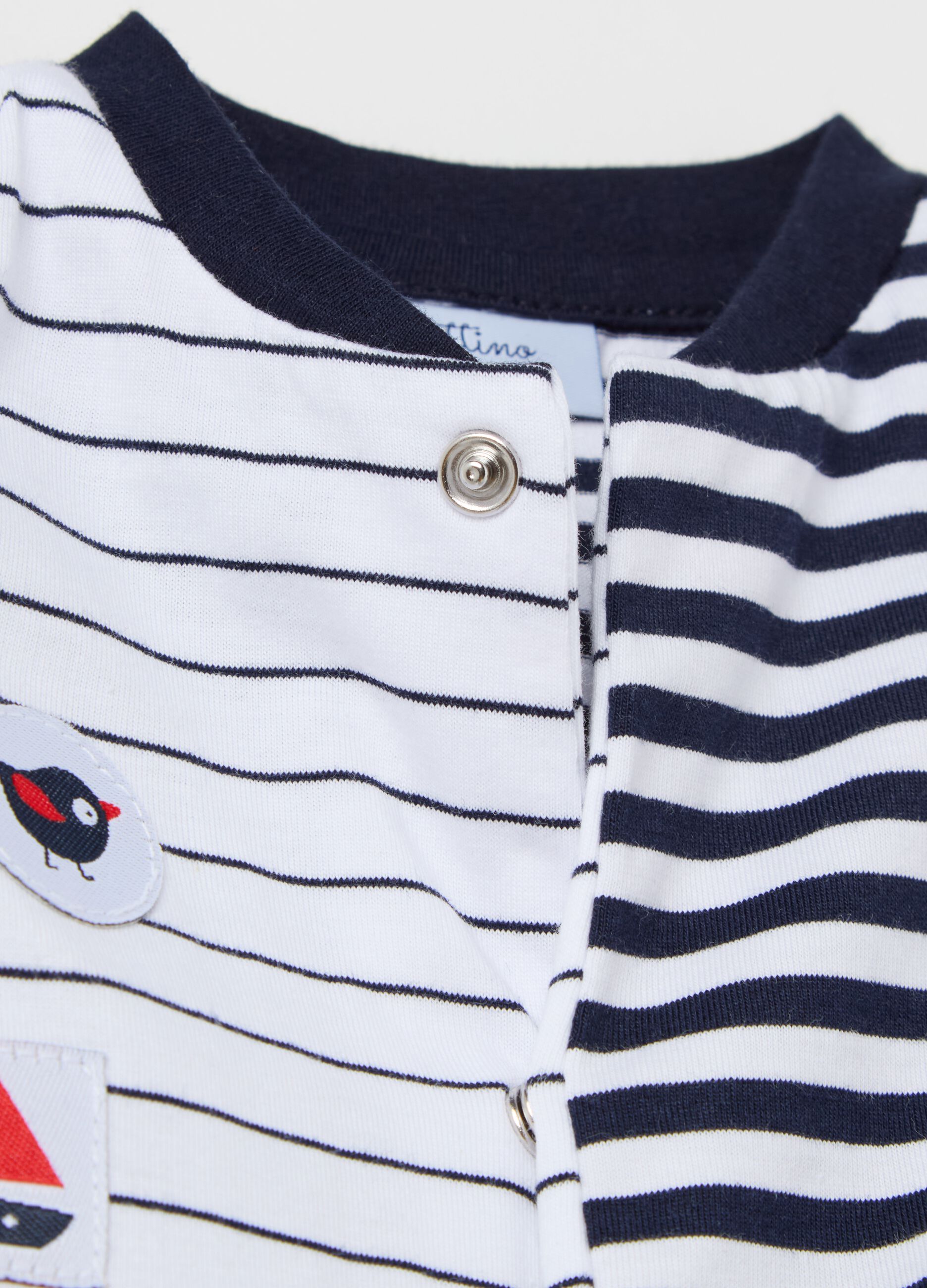 Onesie in striped cotton with feet