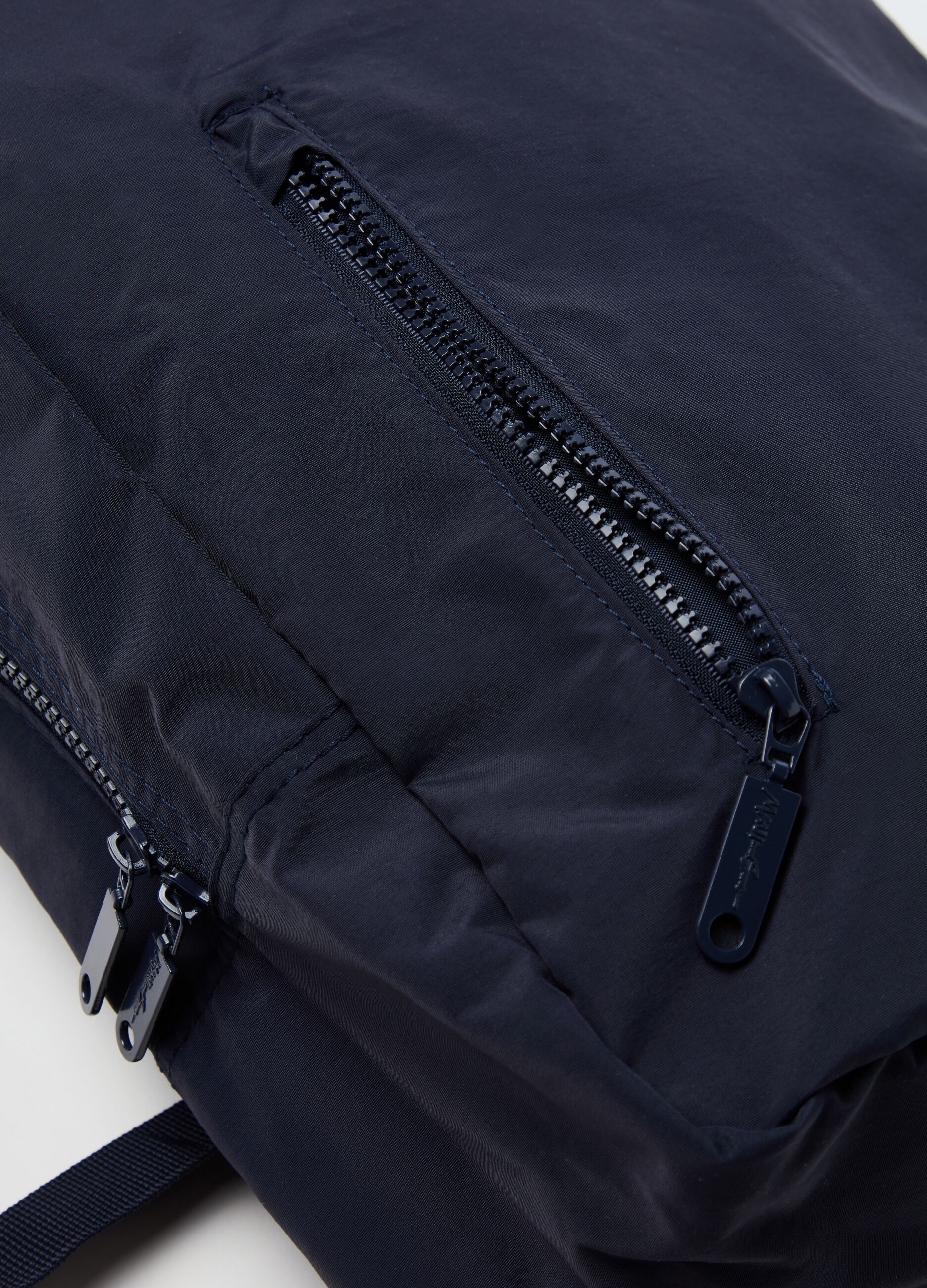 Oval backpack with outside pocket