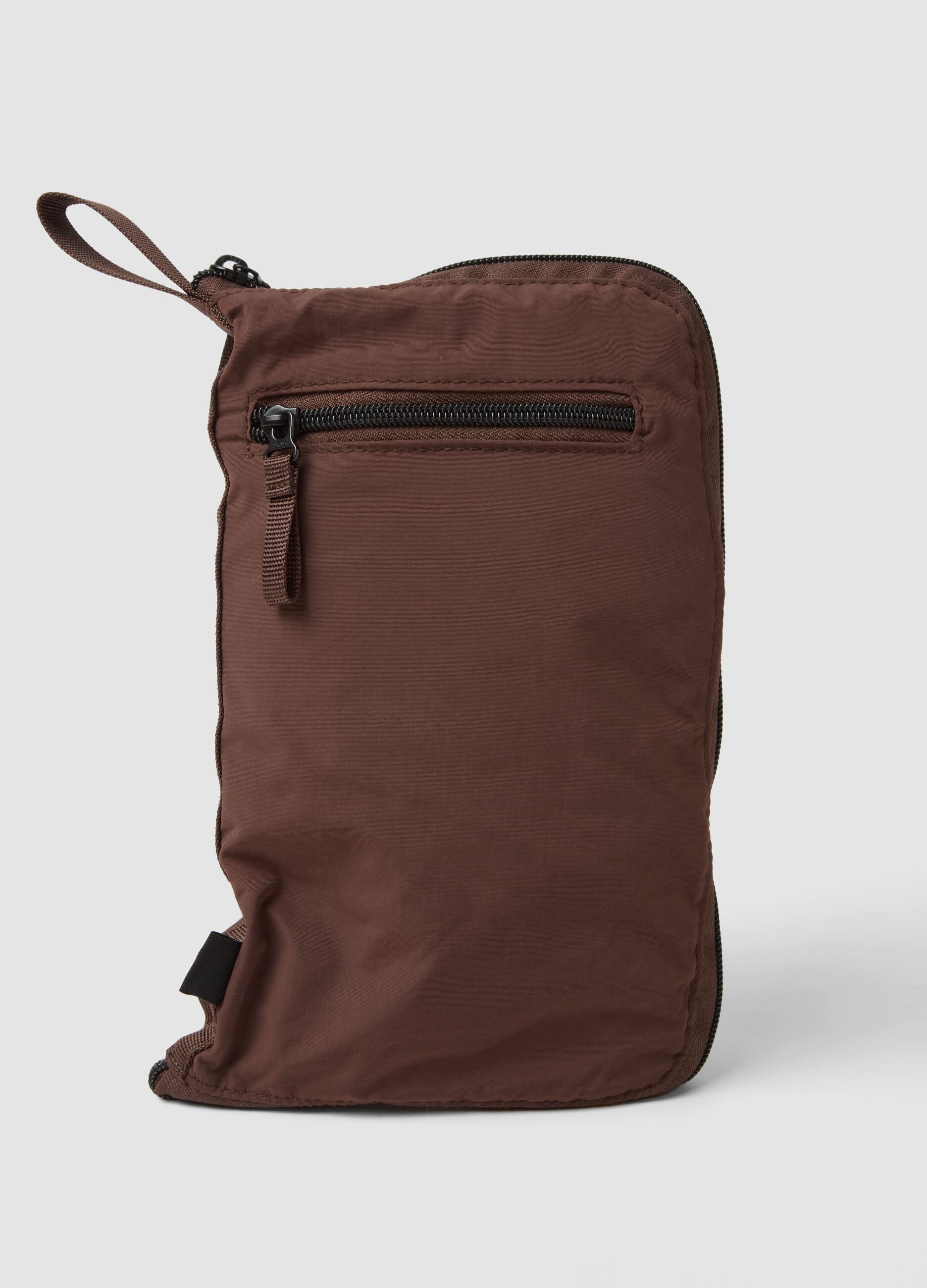 Brown foldable travel bag with shoulder strap and zip pockets