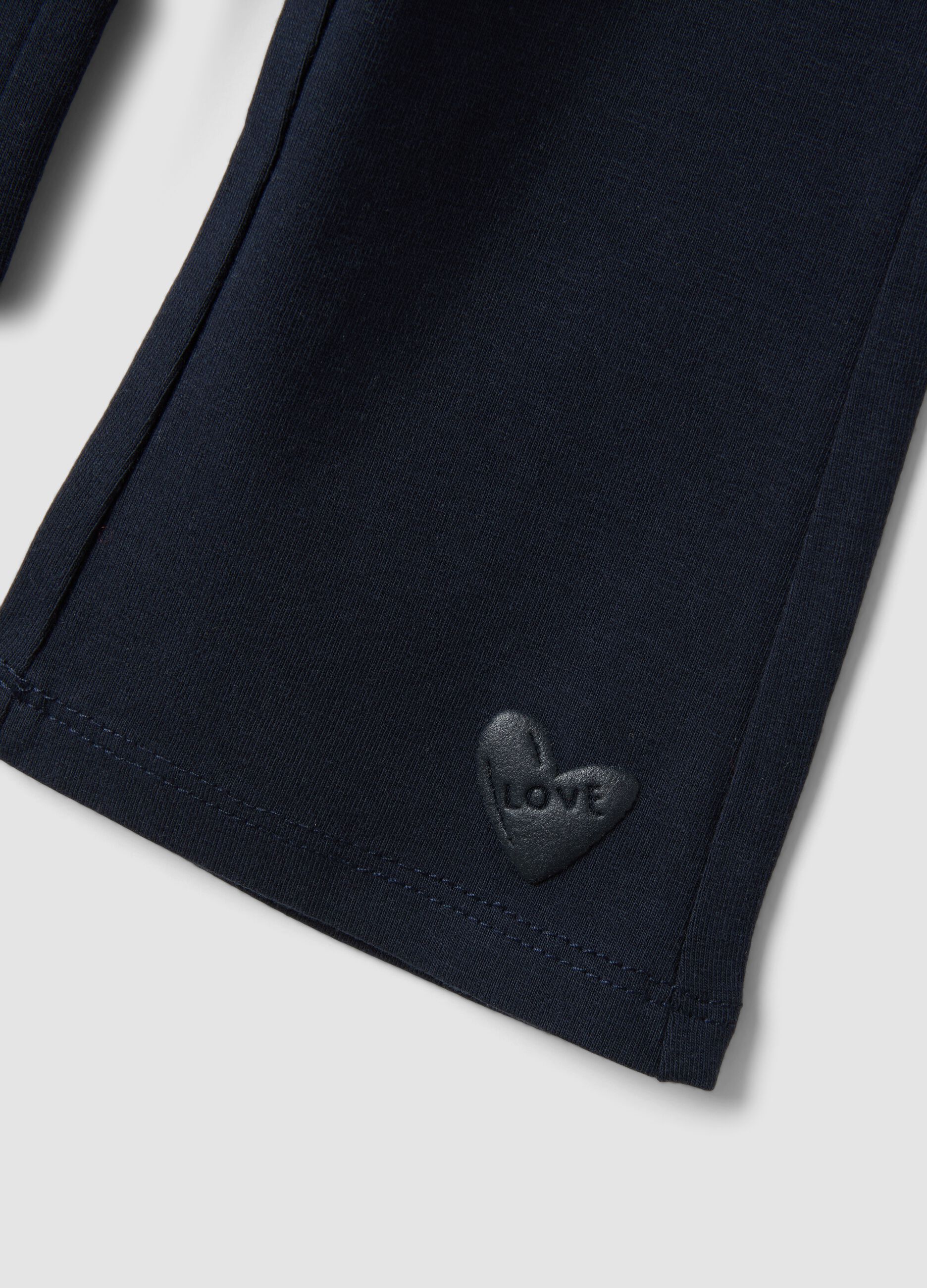 Leggings blu flare in cotone organico elasticizzato con cuore per bimba