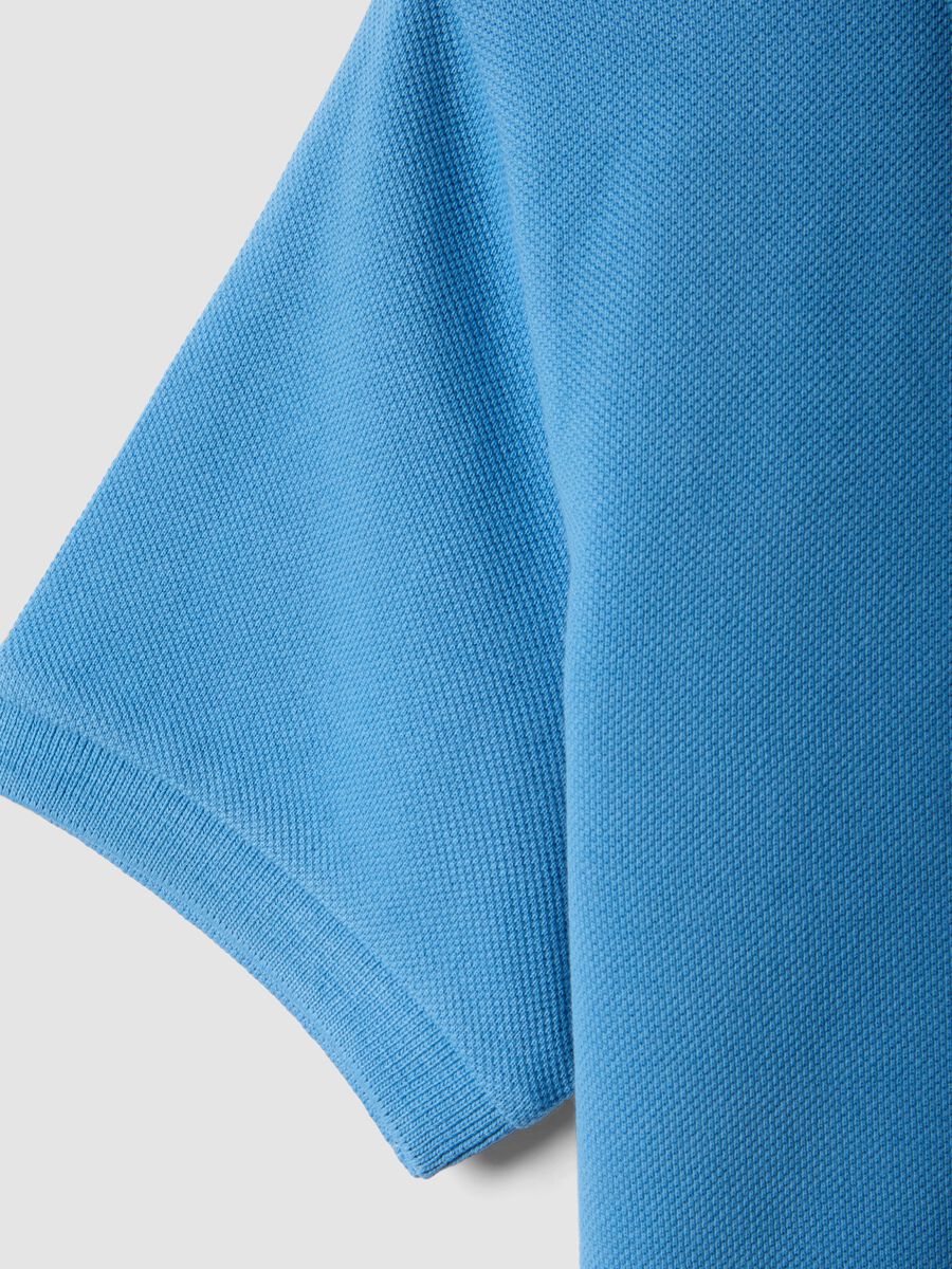 Polo a maniche corte azzurra in puro cotone organico da bambino_3