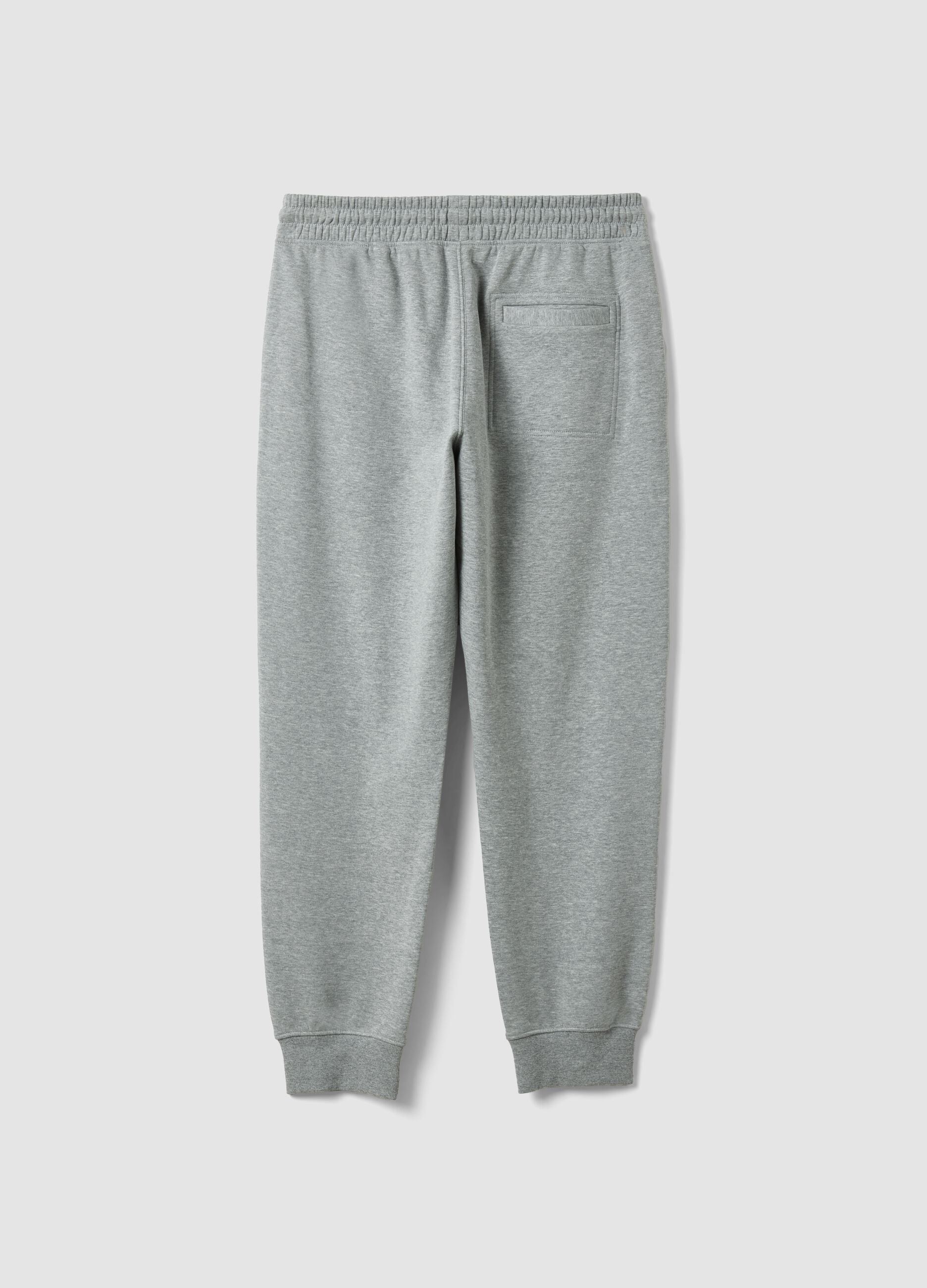 Grey cotton-blend joggers with cuffed hems and drawstring