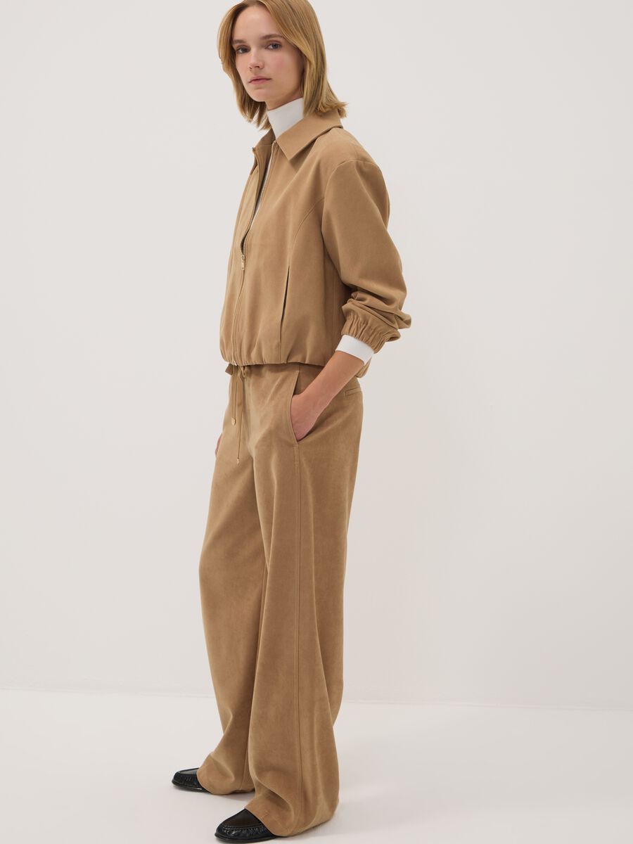 Blazer beige in tessuto elasticizzato con zip over fit_1