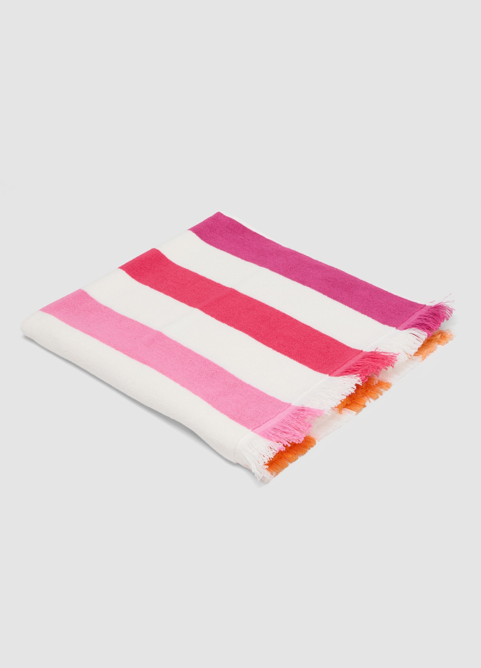 Telo mare multicolor in puro cotone a righe e con frange