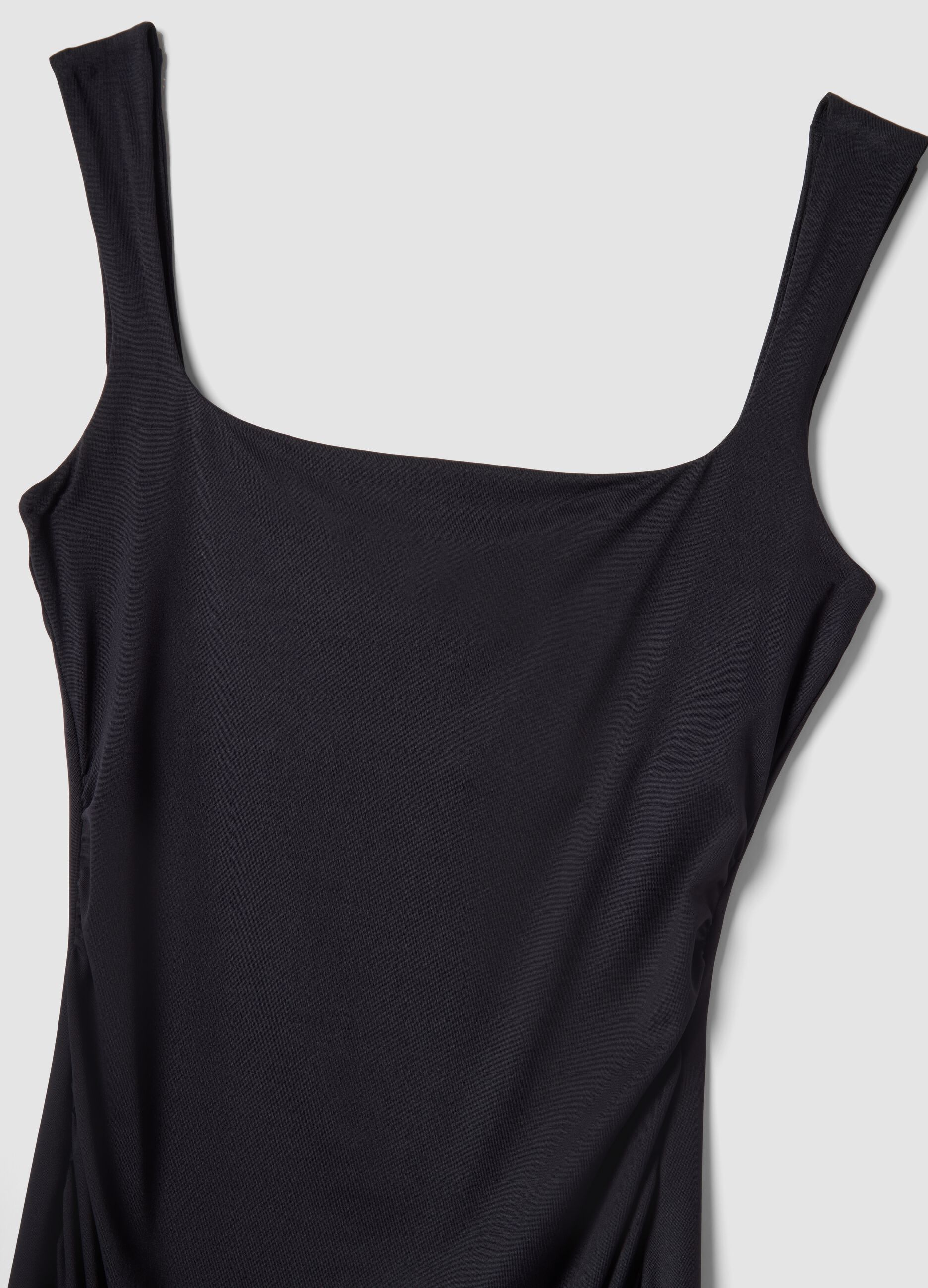 Black fitted dress with square neckline