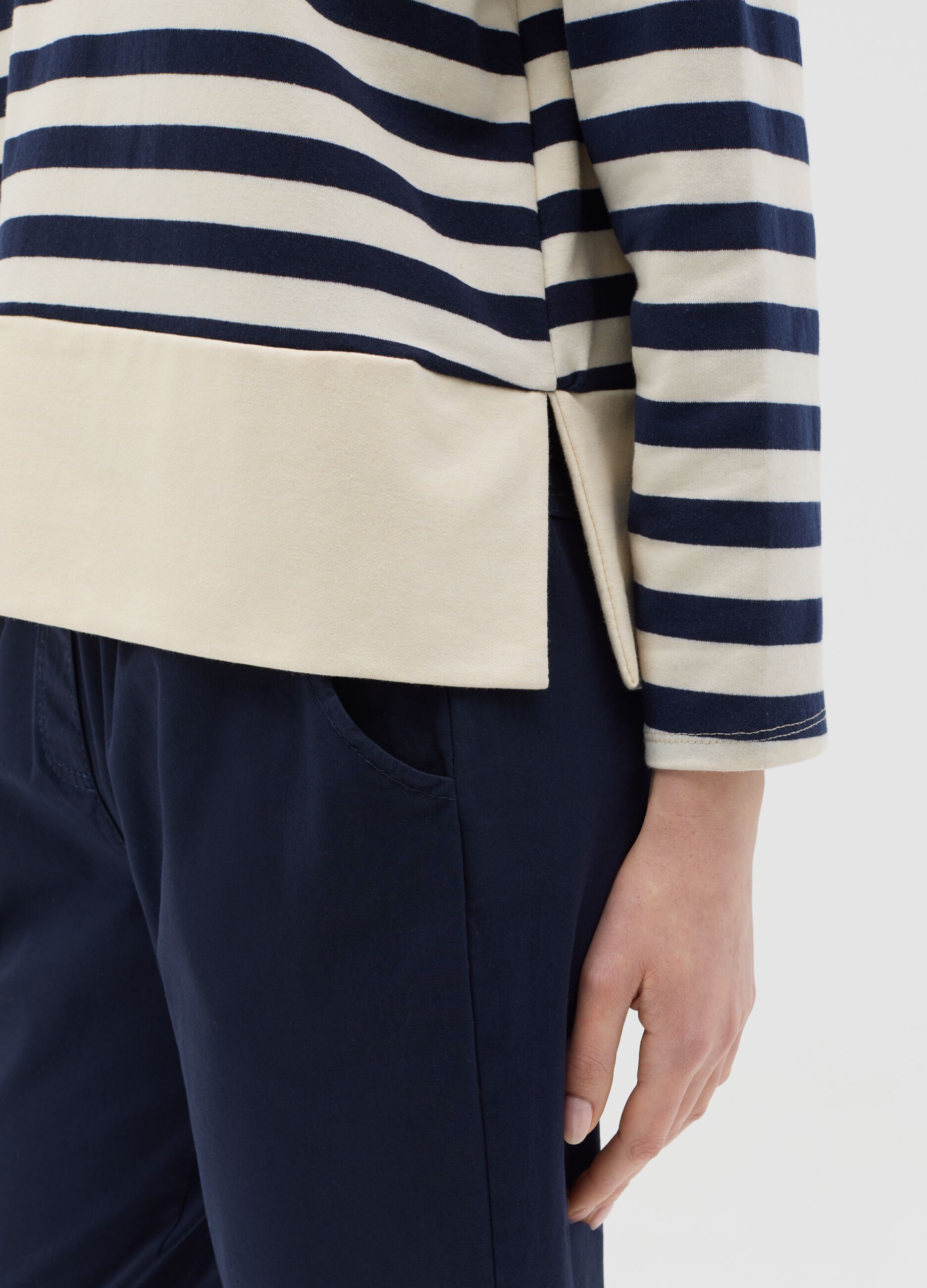 Blue and white striped top with long sleeves
