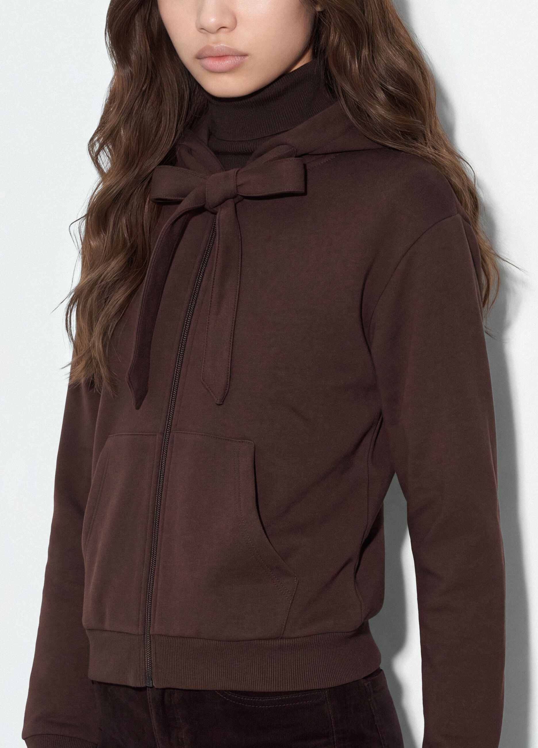 Brown hoodie with tied drawstring, relaxed fit