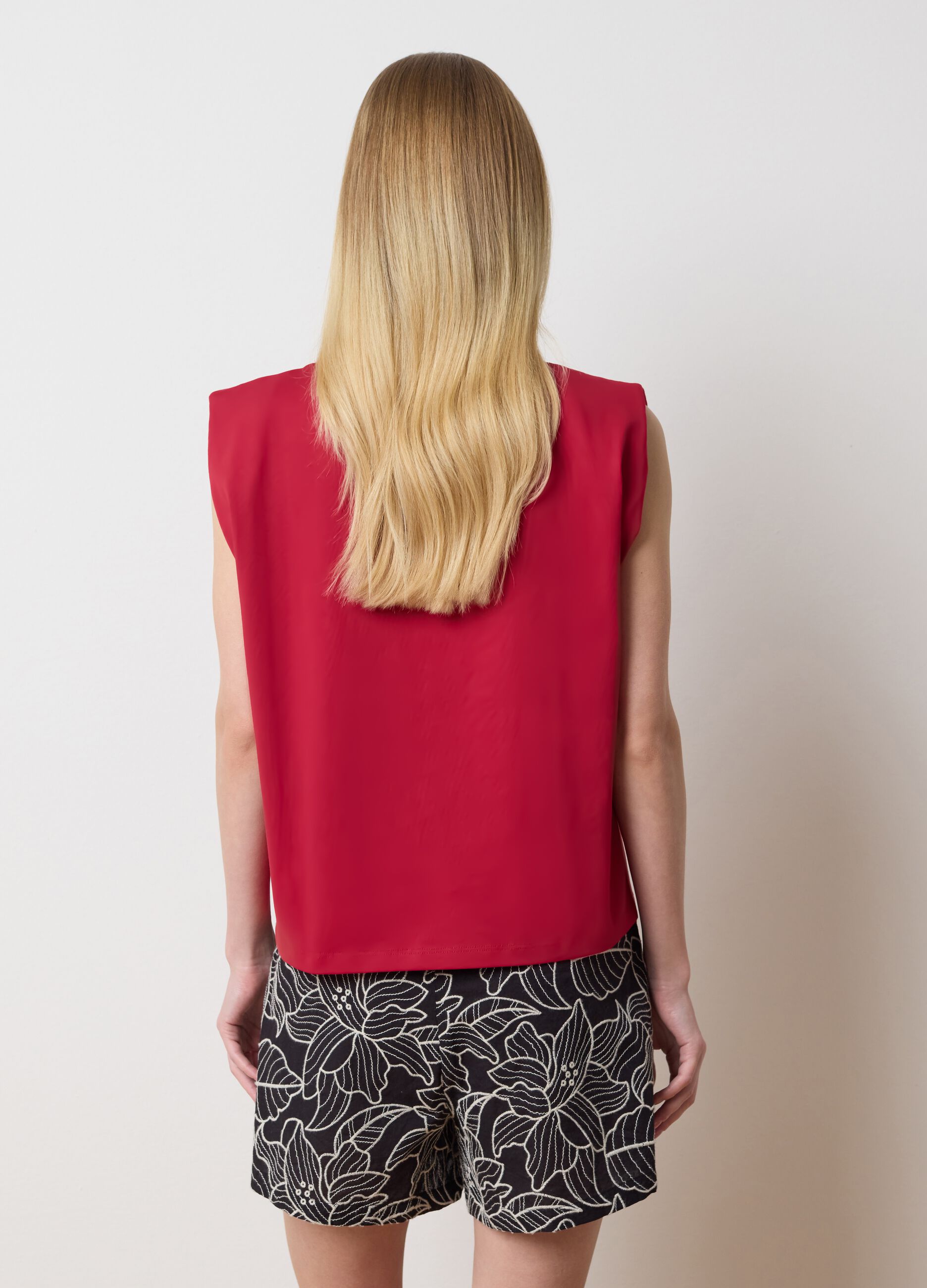 Red sleeveless boxy-fit T-shirt with spaghetti straps