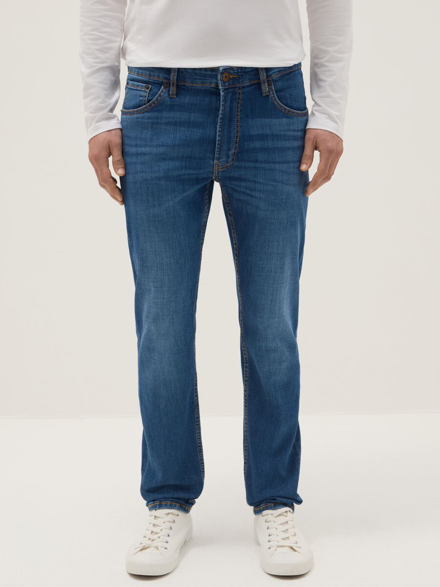 Jeans in cotone elasticizzato blu slim fit con cinque tasche_1