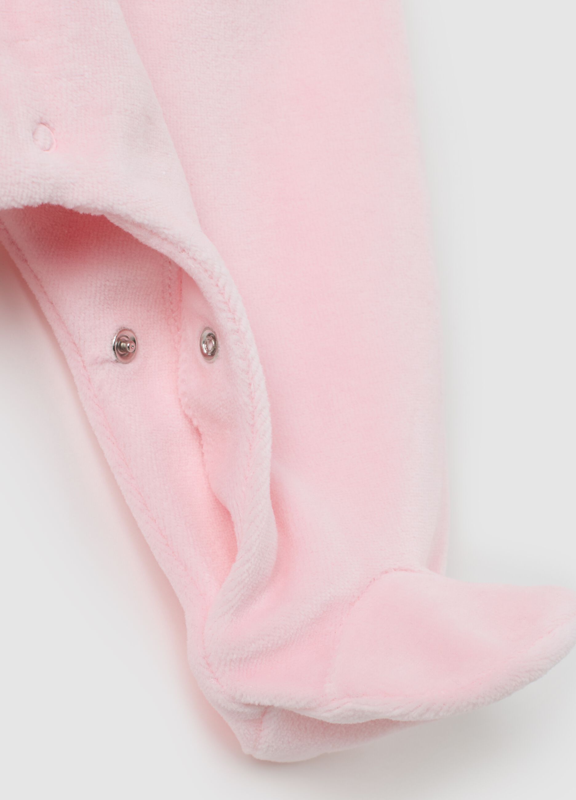 Pink cotton baby romper with snap closure