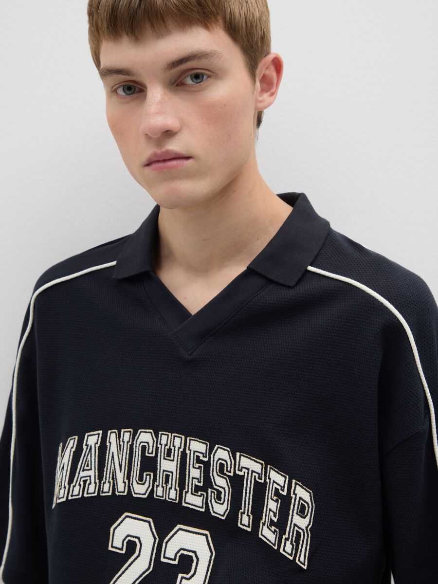 Polo sportiva in puro cotone nero vestibilità oversize_3