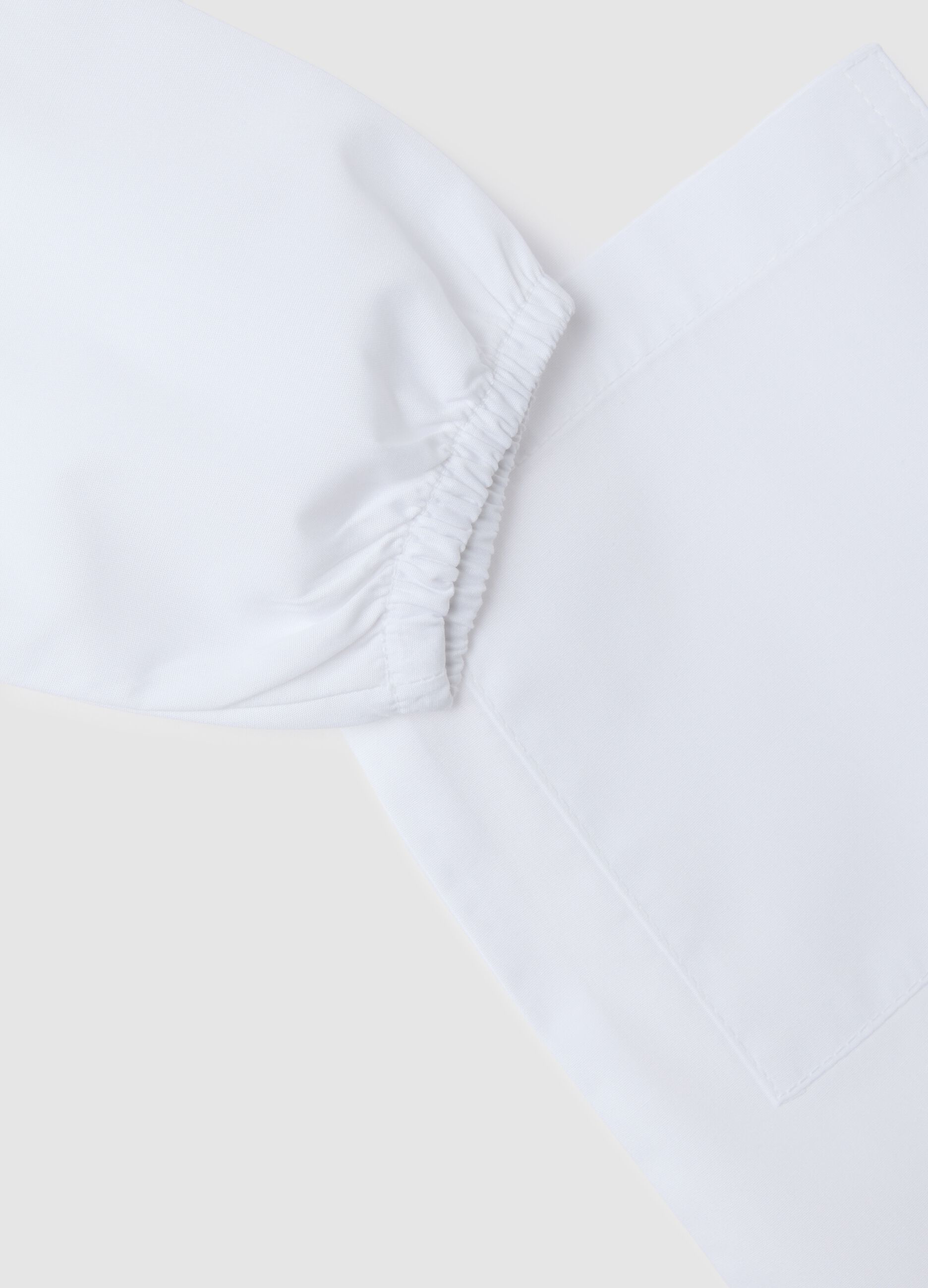 Children's school smock in white cotton blend with embroidery