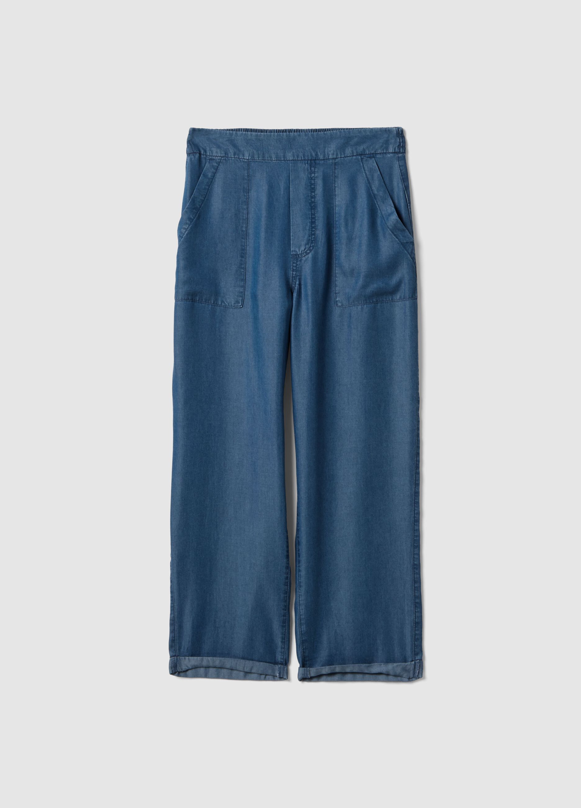 Light blue denim jeans in 100% lyocell with elasticated waist, relaxed fit