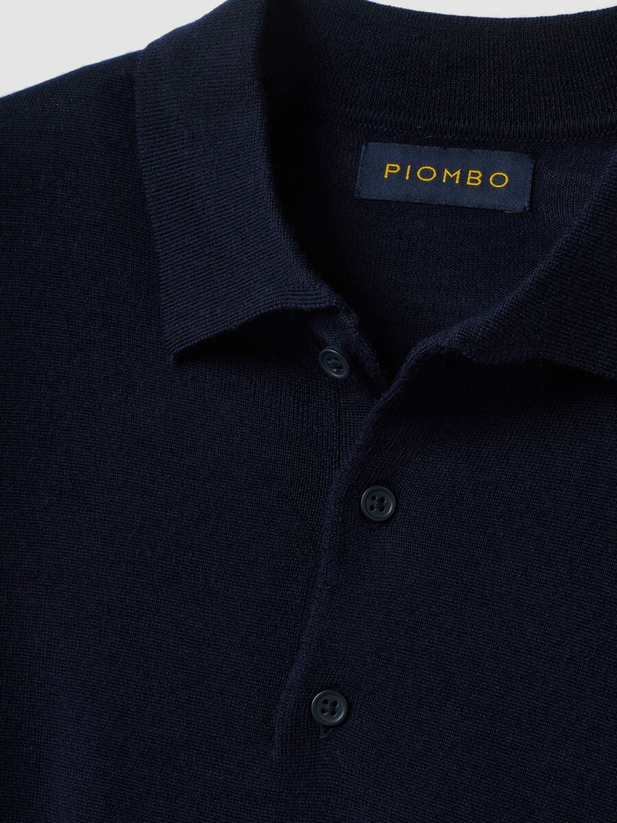 Maglia polo blu in pura lana merino con colletto polo_1