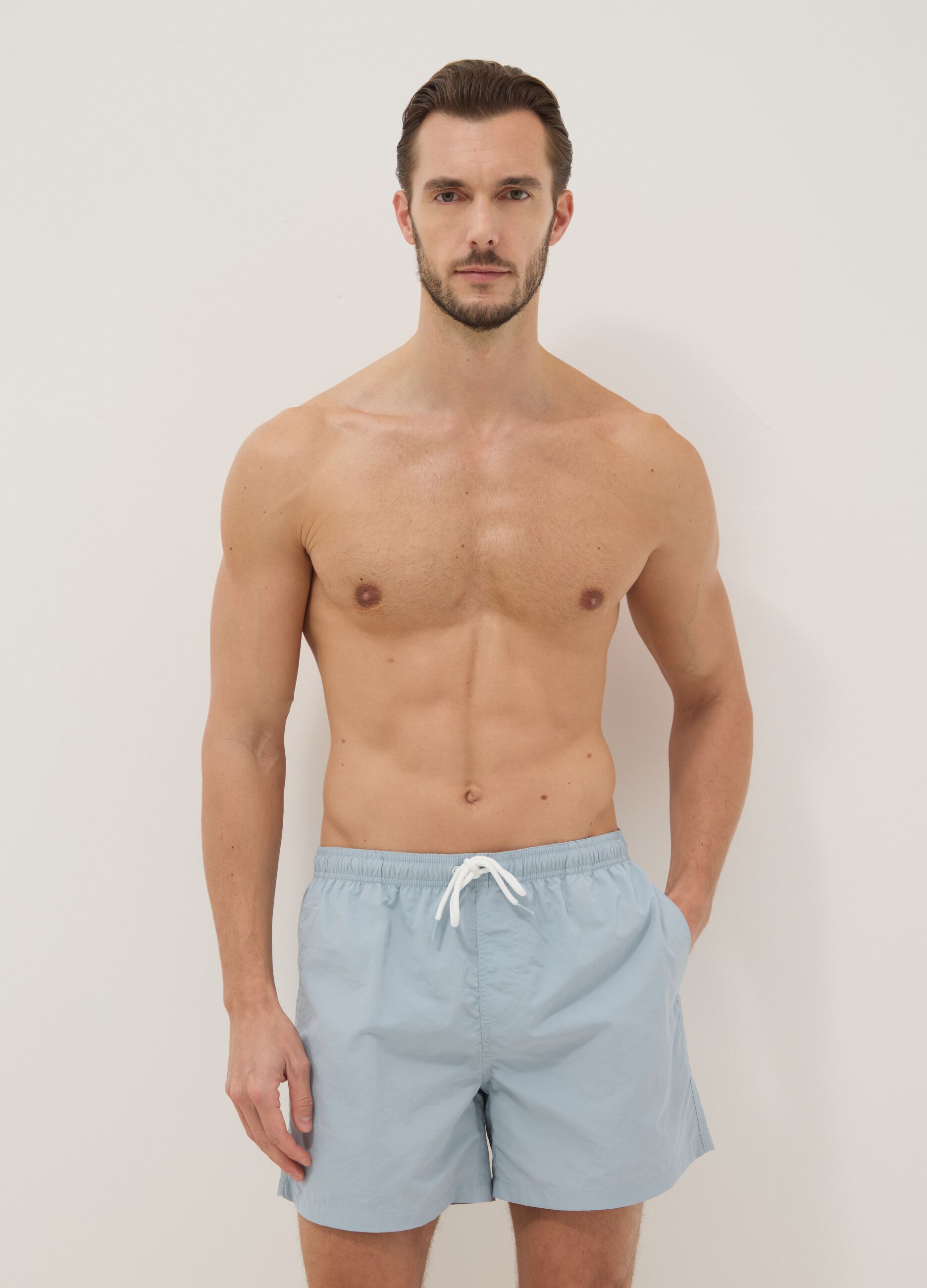 Blue swim shorts with elasticated waistband