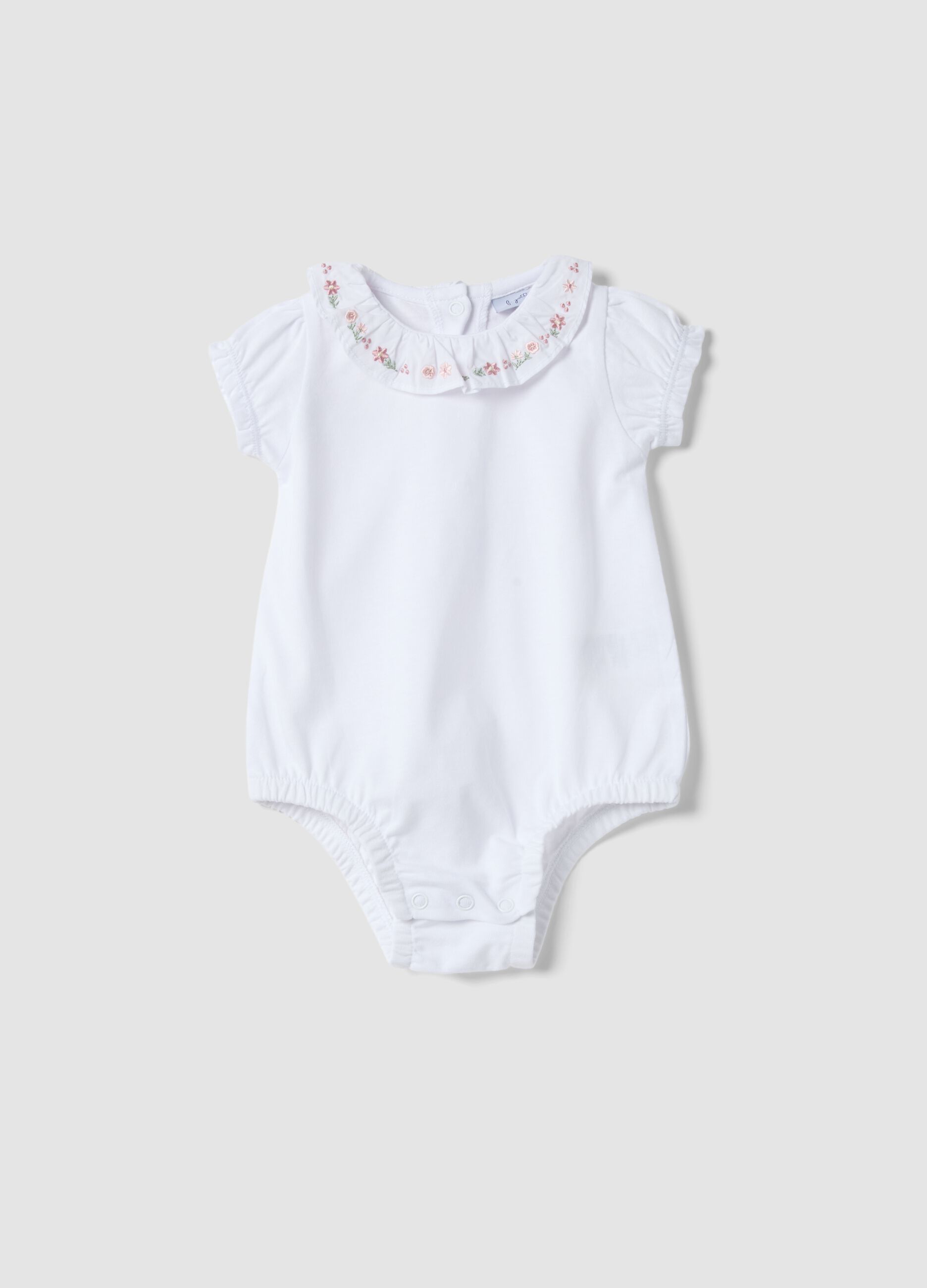 White organic cotton baby bodysuit with ruffled collar