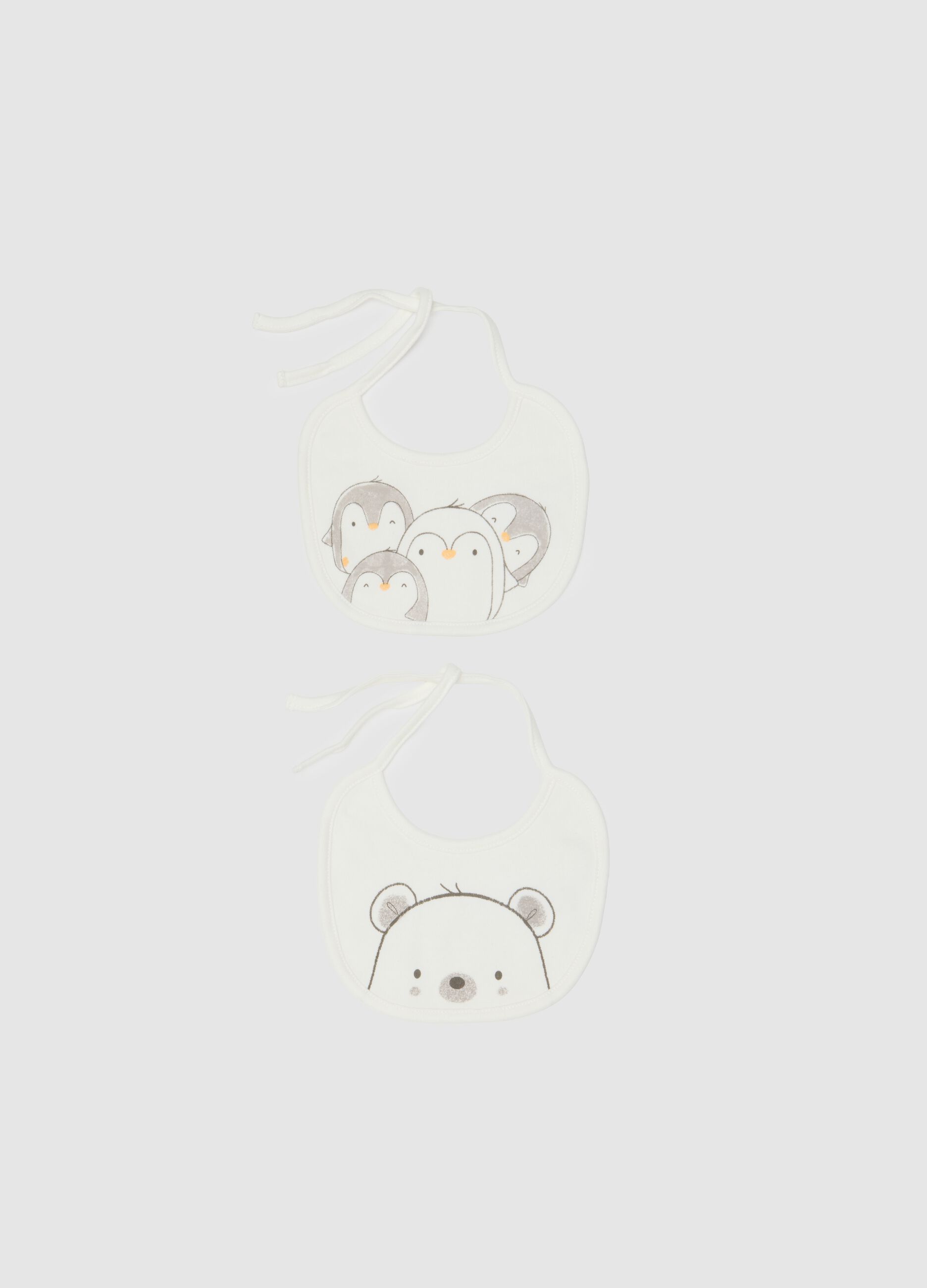Twin pack of white cotton bibs with animal prints