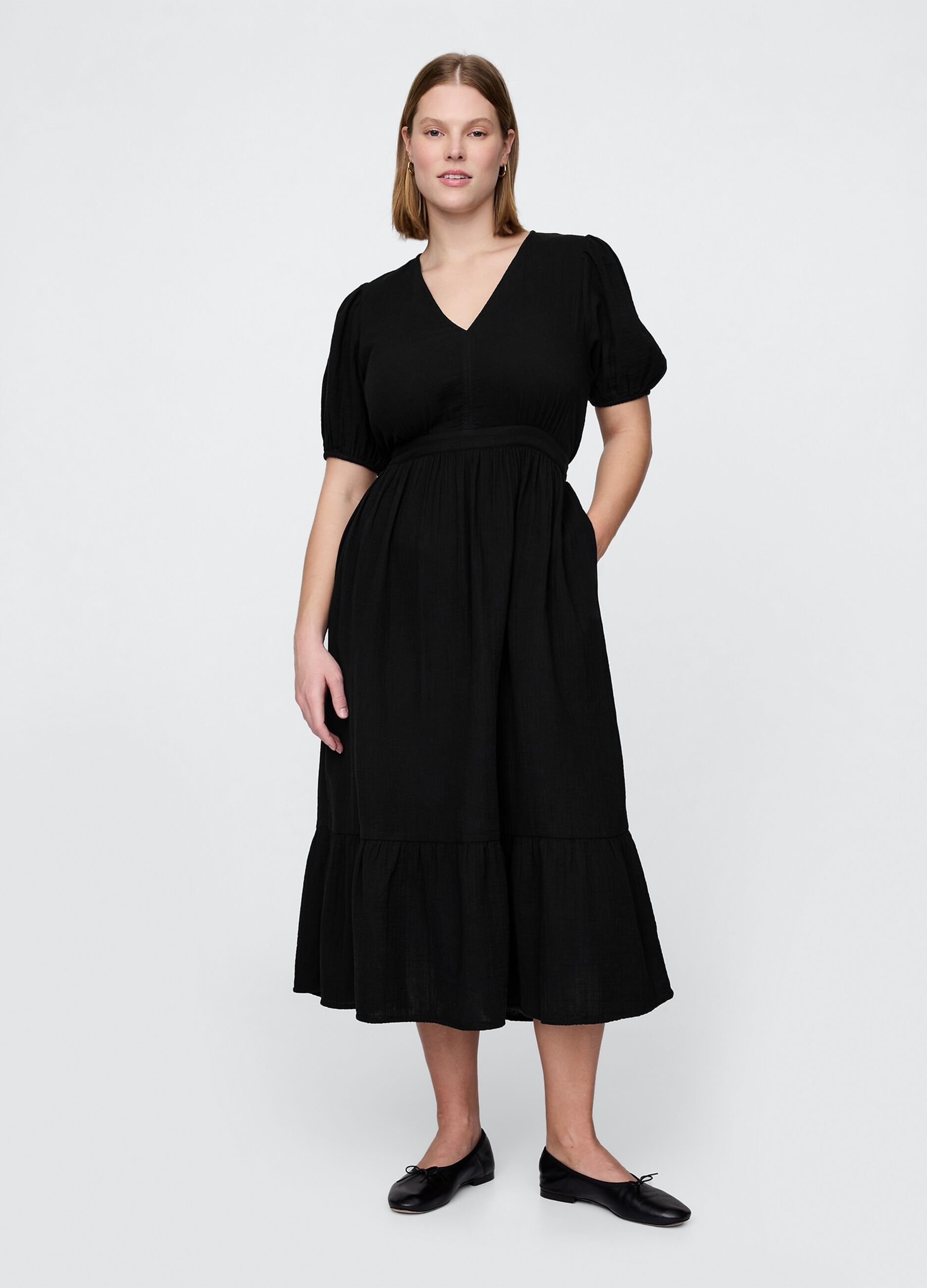 Long black dress with V-neck and open back